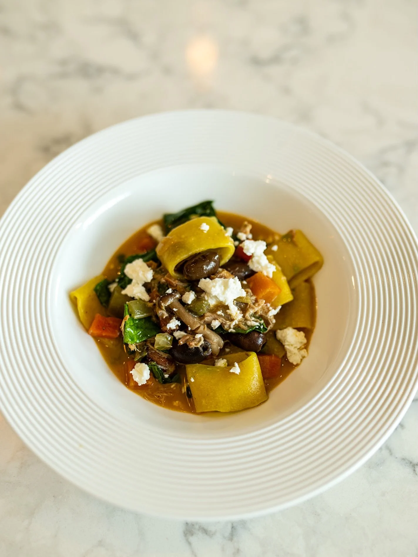 Braised Rabbit Paccheri &mdash; tender, slow-braised rabbit with mushrooms, capers, and olives, finished with a bright splash of Pinot Grigio. 

#lucastonybrook
