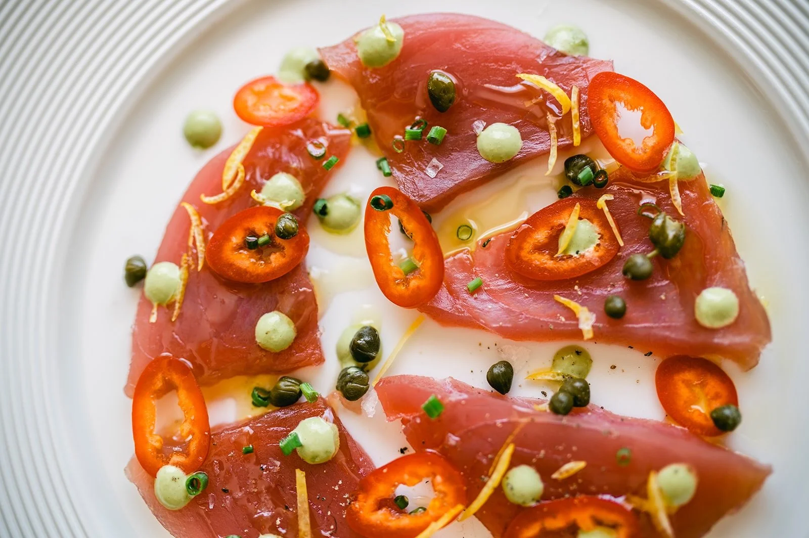 ✨ Montauk Tuna Carpaccio ✨

Fresh Montauk tuna, thinly sliced and beautifully balanced with Fresno chili, chickpeas, basil, and capers. Bright, delicate, and full of coastal flavor.

A perfect start to your evening. 

#lucastonybrook