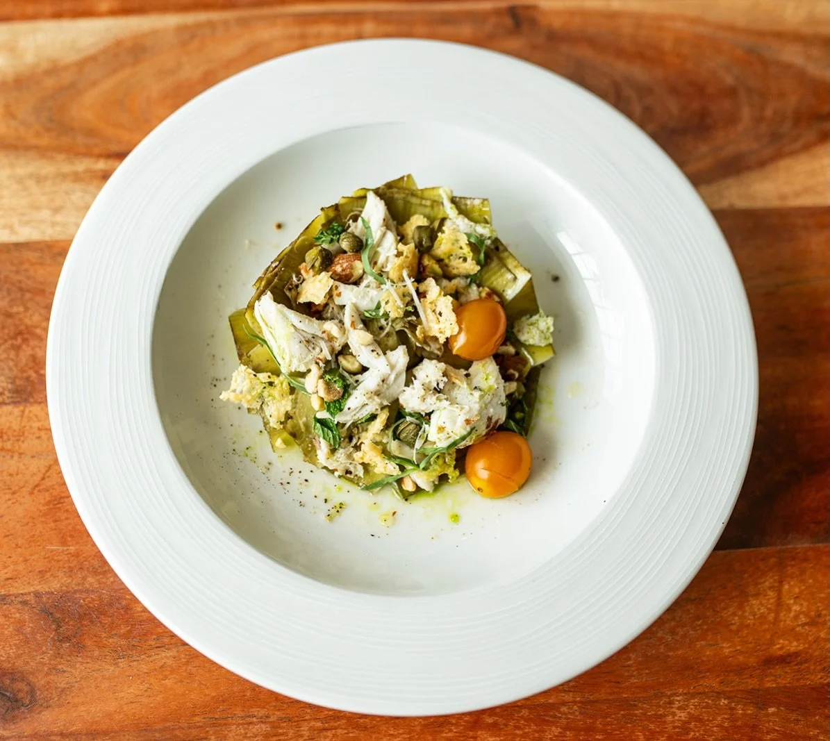 Artichoke &amp; Crab

Fresh artichoke, sweet crab, bright lemon, toasted almond, and mint come together in a dish that&rsquo;s light, vibrant, and full of flavor.

#lucastonybrook
