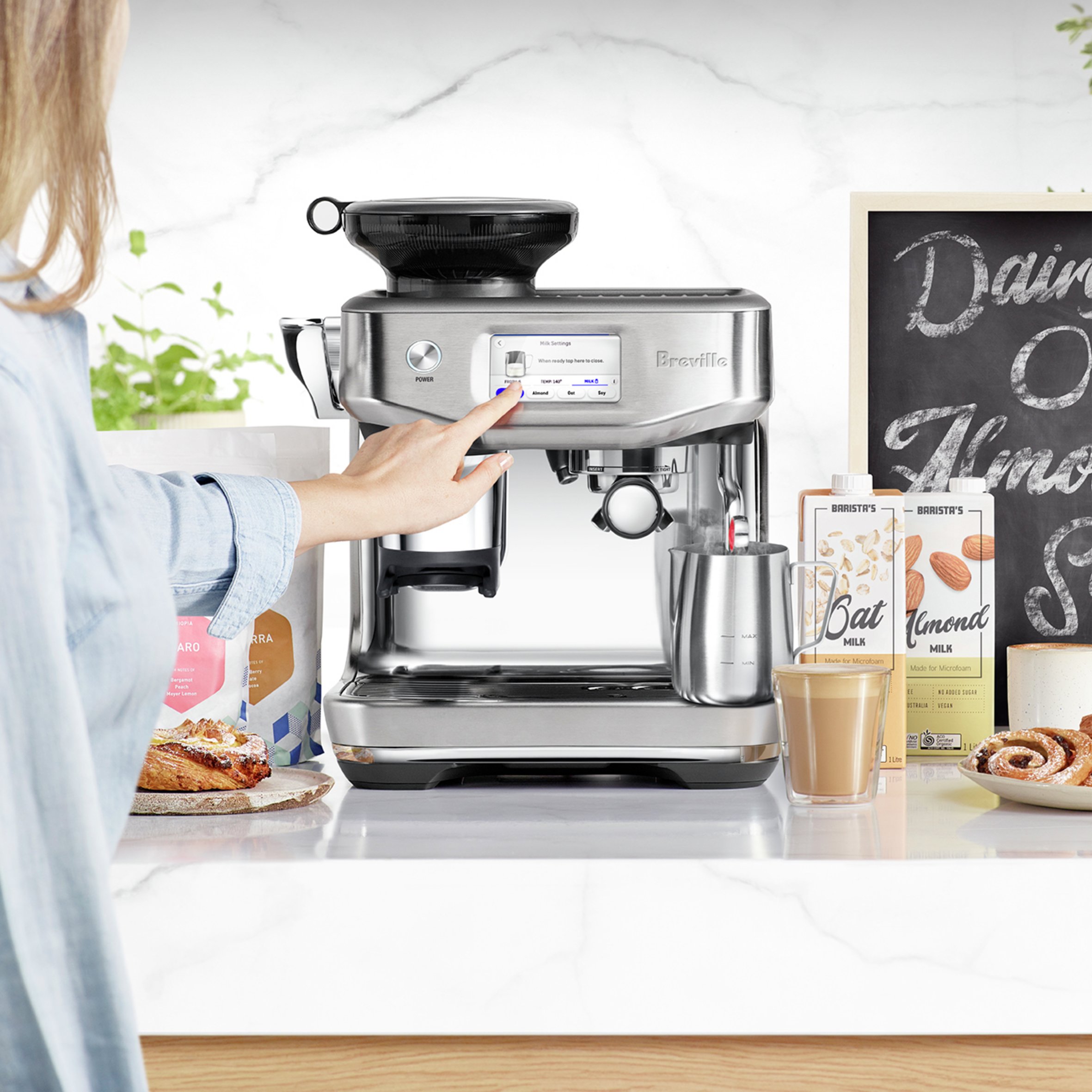 image of espresso machine touchscreen being used