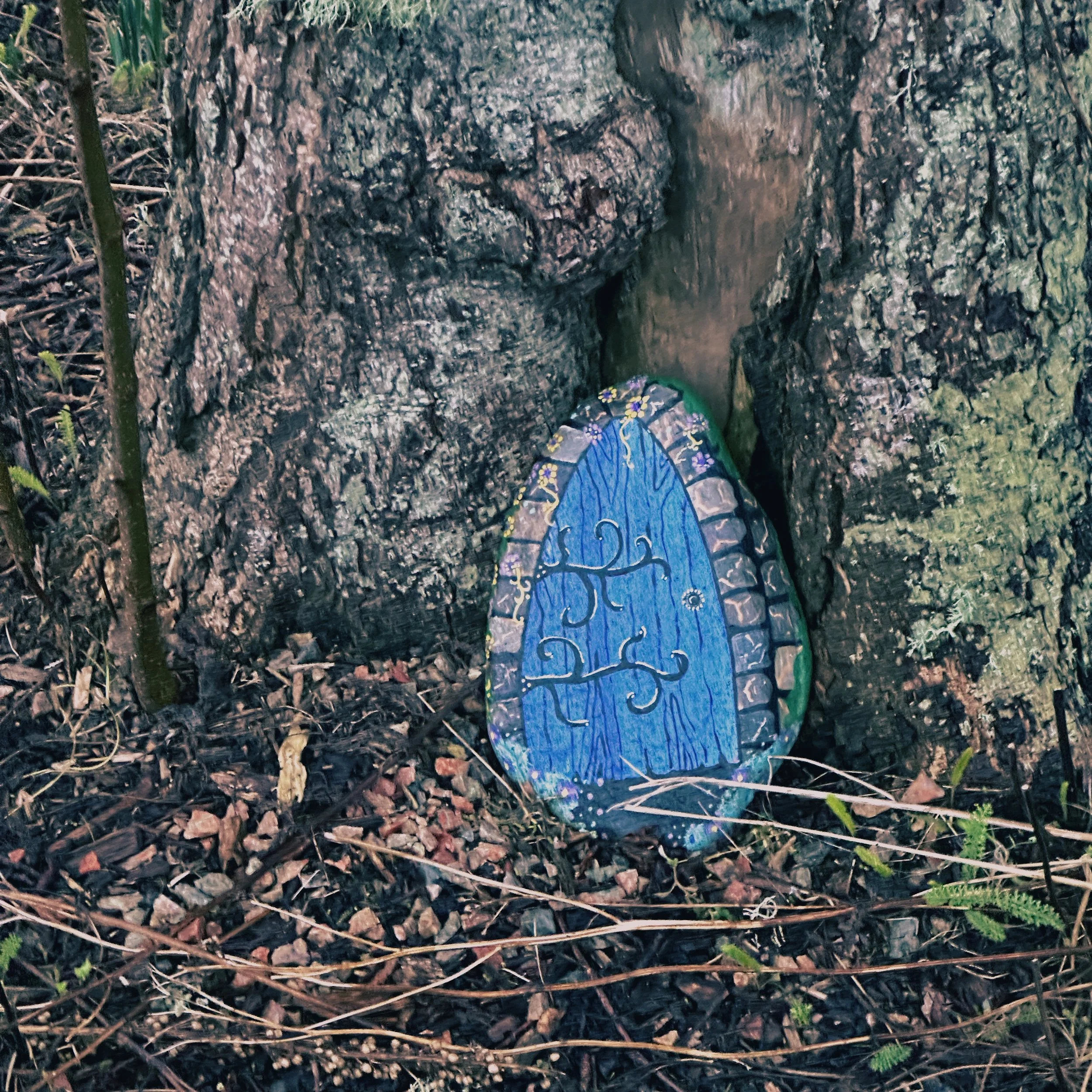 A pebble painted to resemble a door