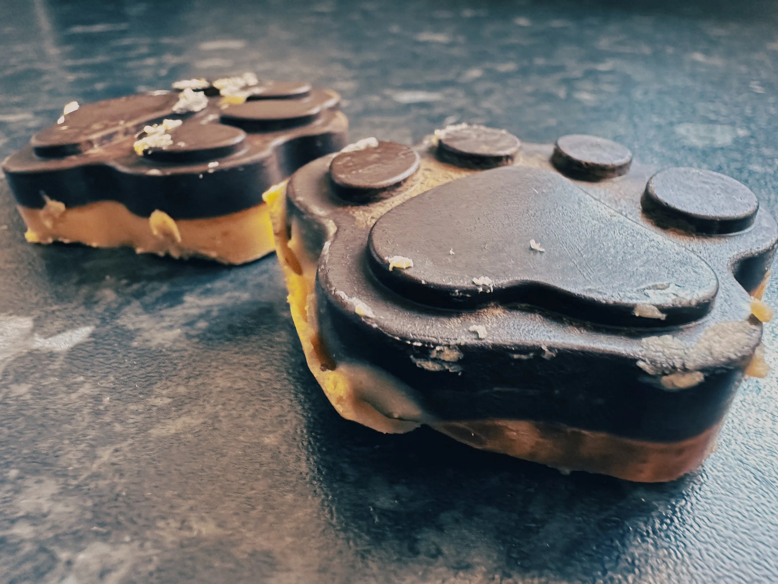 Carob and peanut butter paw-shaped treats.