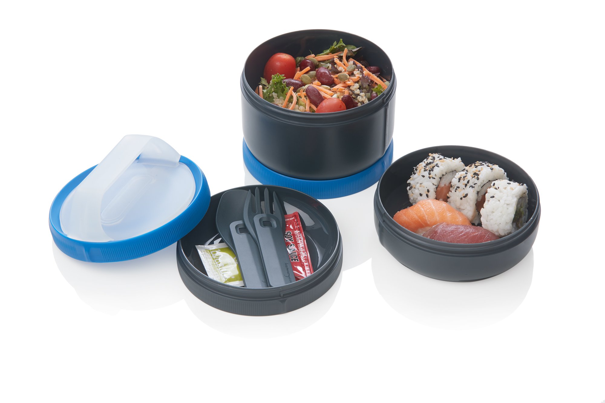 Stackable lunch containers with salad, sushi, and utensils on a white background.