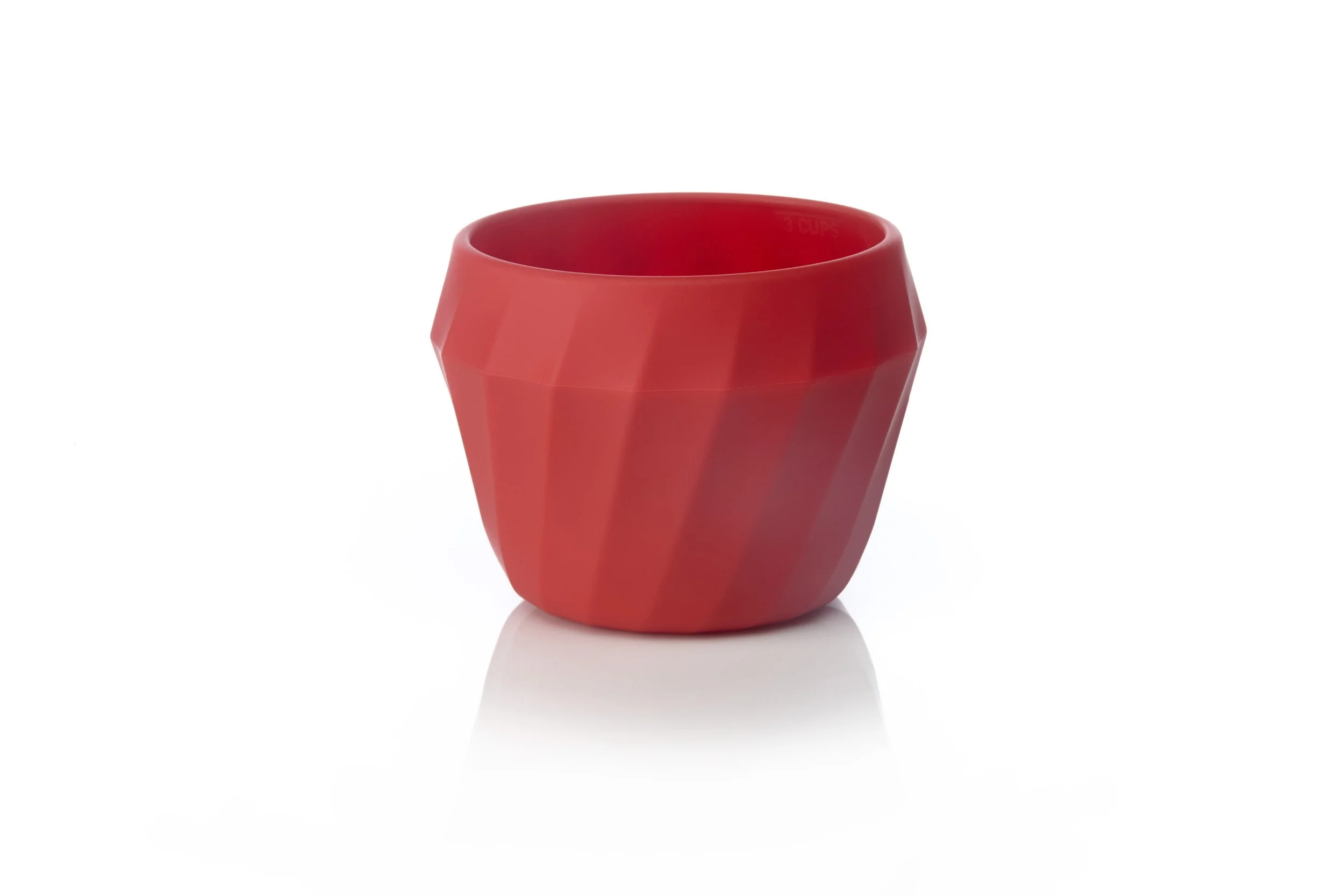 Red geometric ceramic cup on a white background