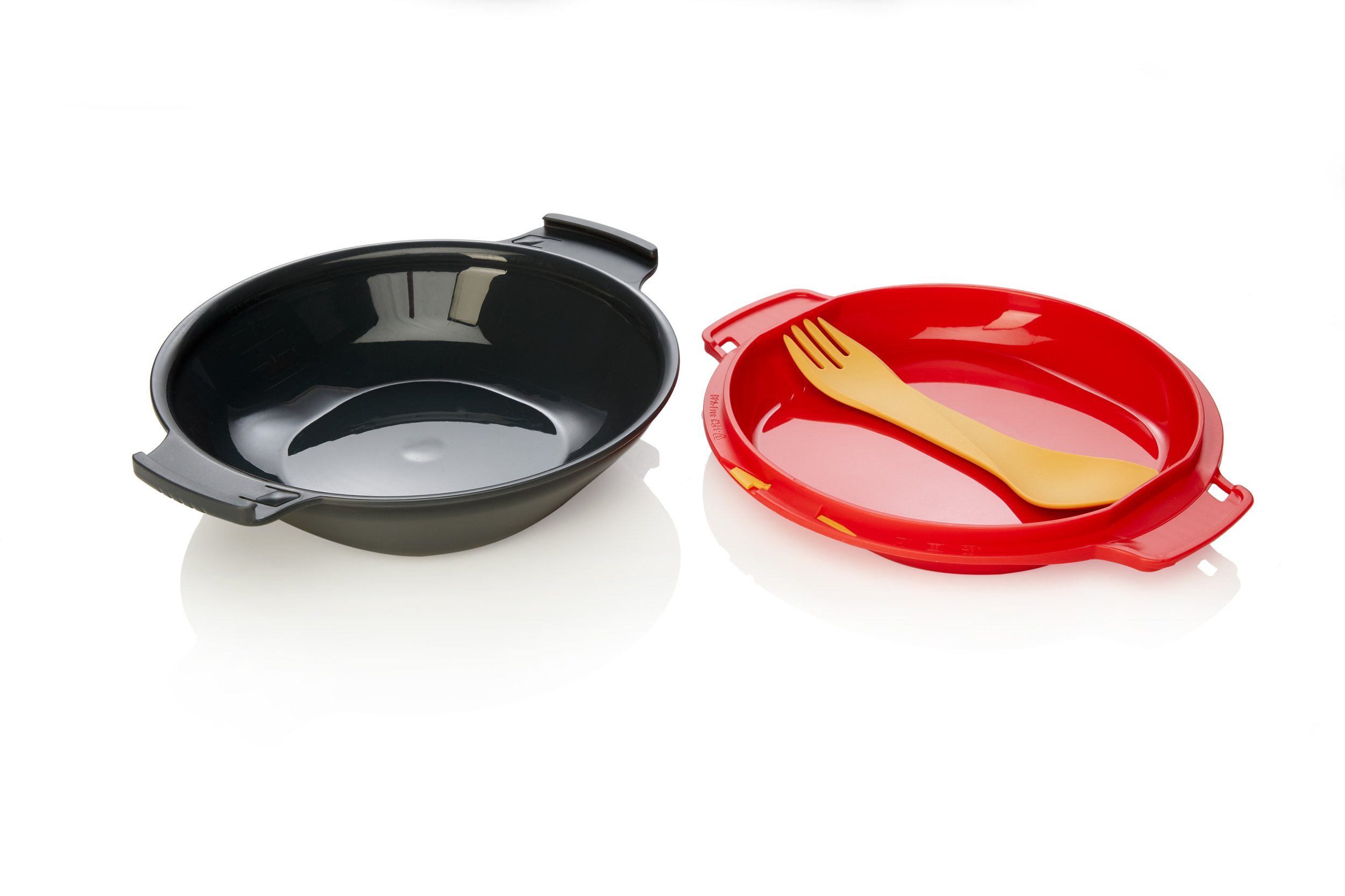 Two plastic bowls, one black and one red, with a yellow spork on the red bowl, against a white background.