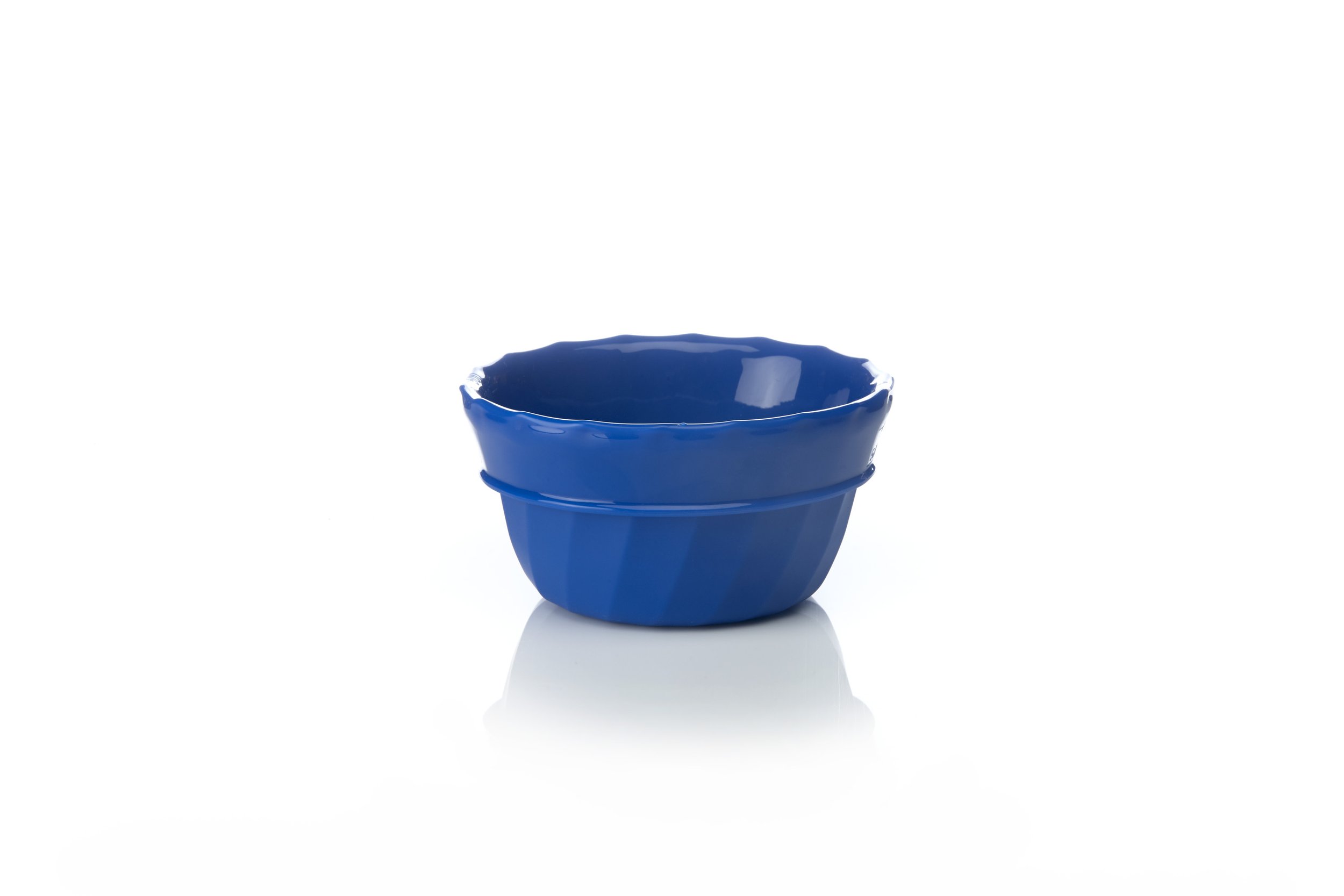 Small blue ceramic bowl on white background.