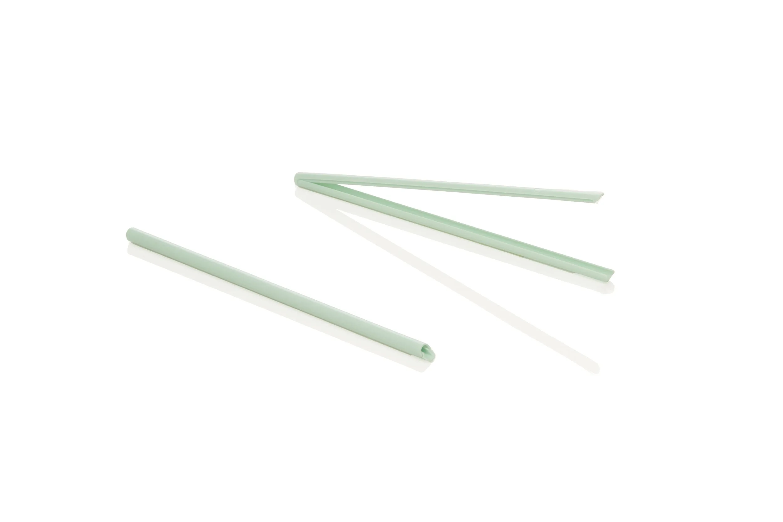 Folded green straw on a white background