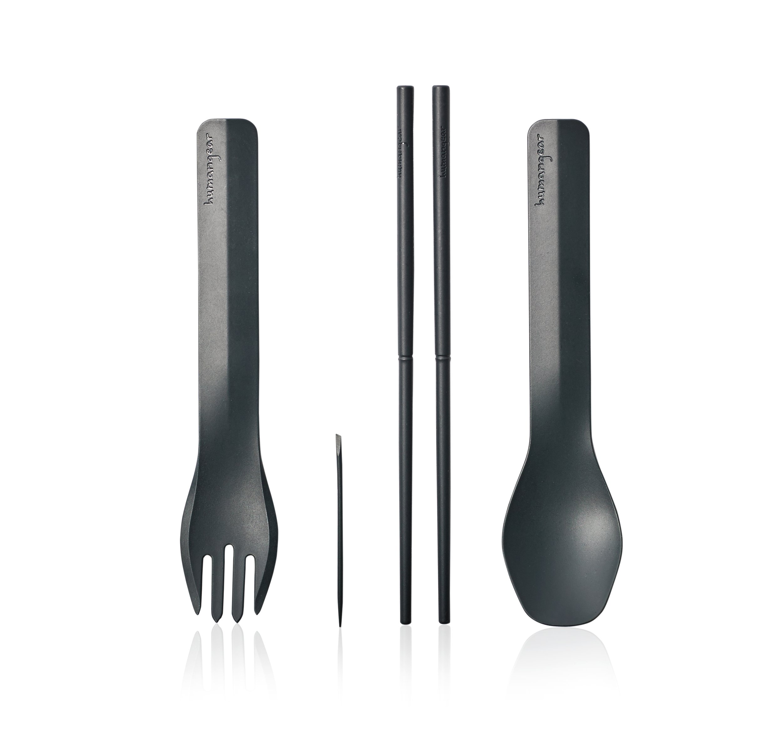 Set of black utensils including a spork, chopsticks, and a spoon on a white background.