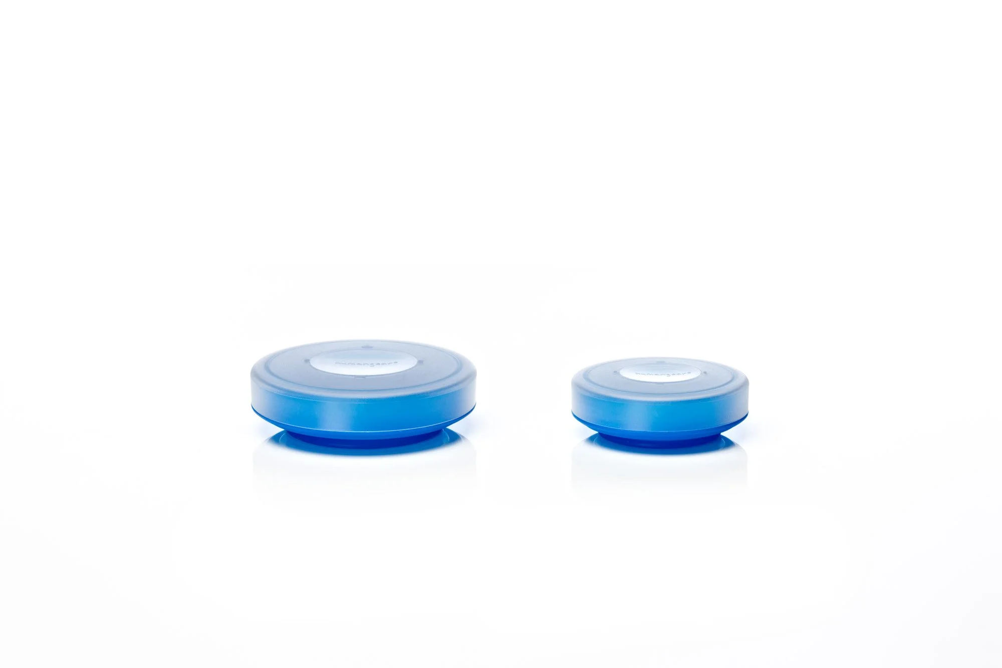 Two round blue plastic containers with lids on a white background