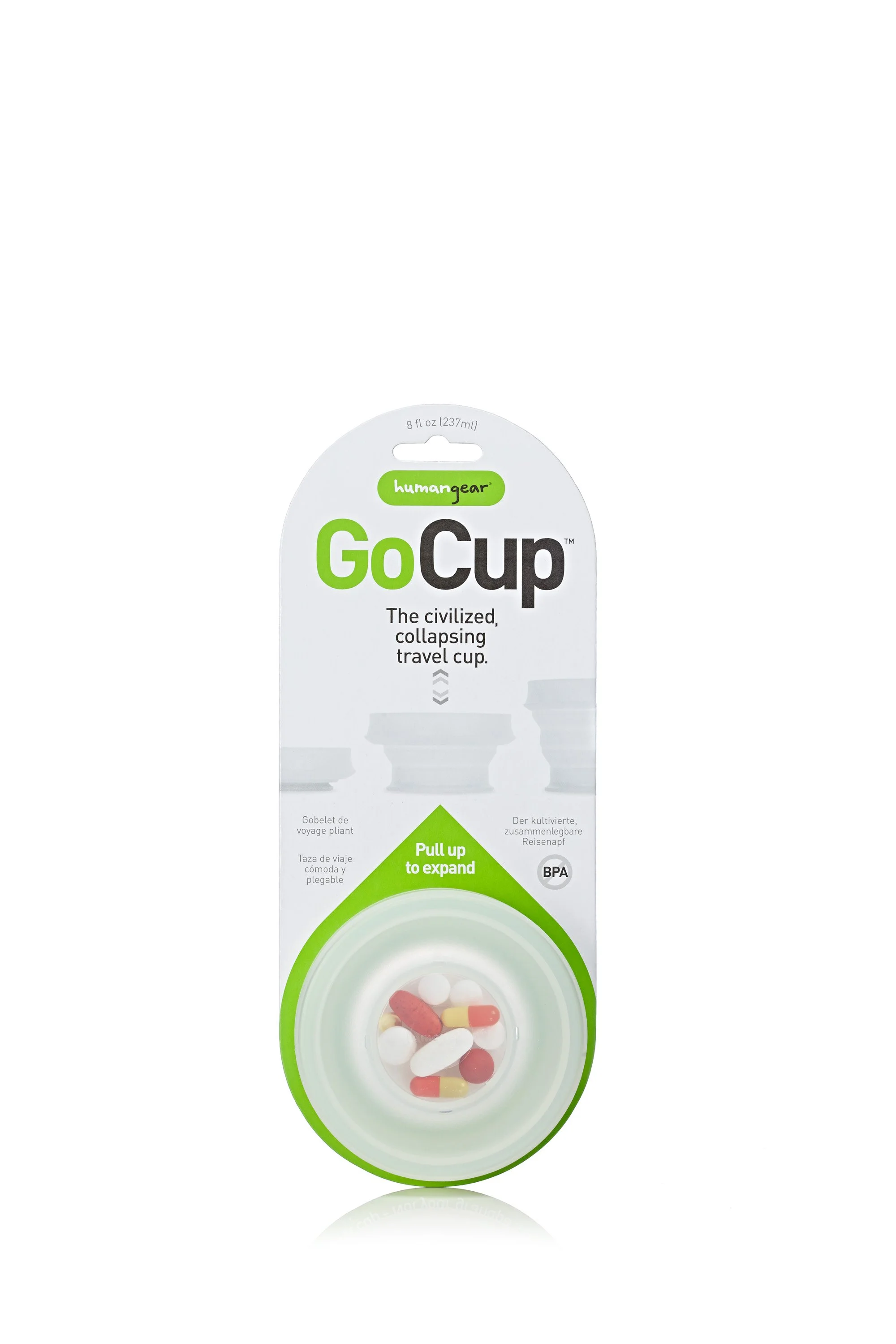 Collapsible travel cup in package with capsules inside.