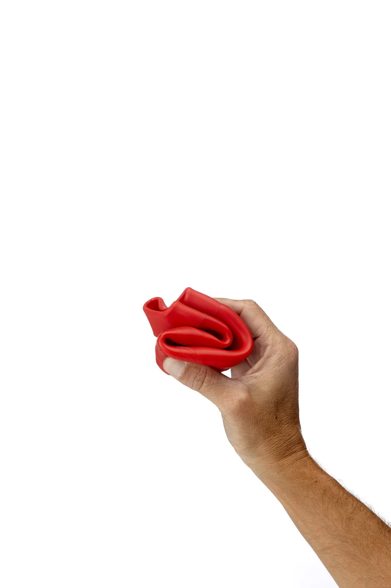 Person holding a deflated red balloon against a white background.