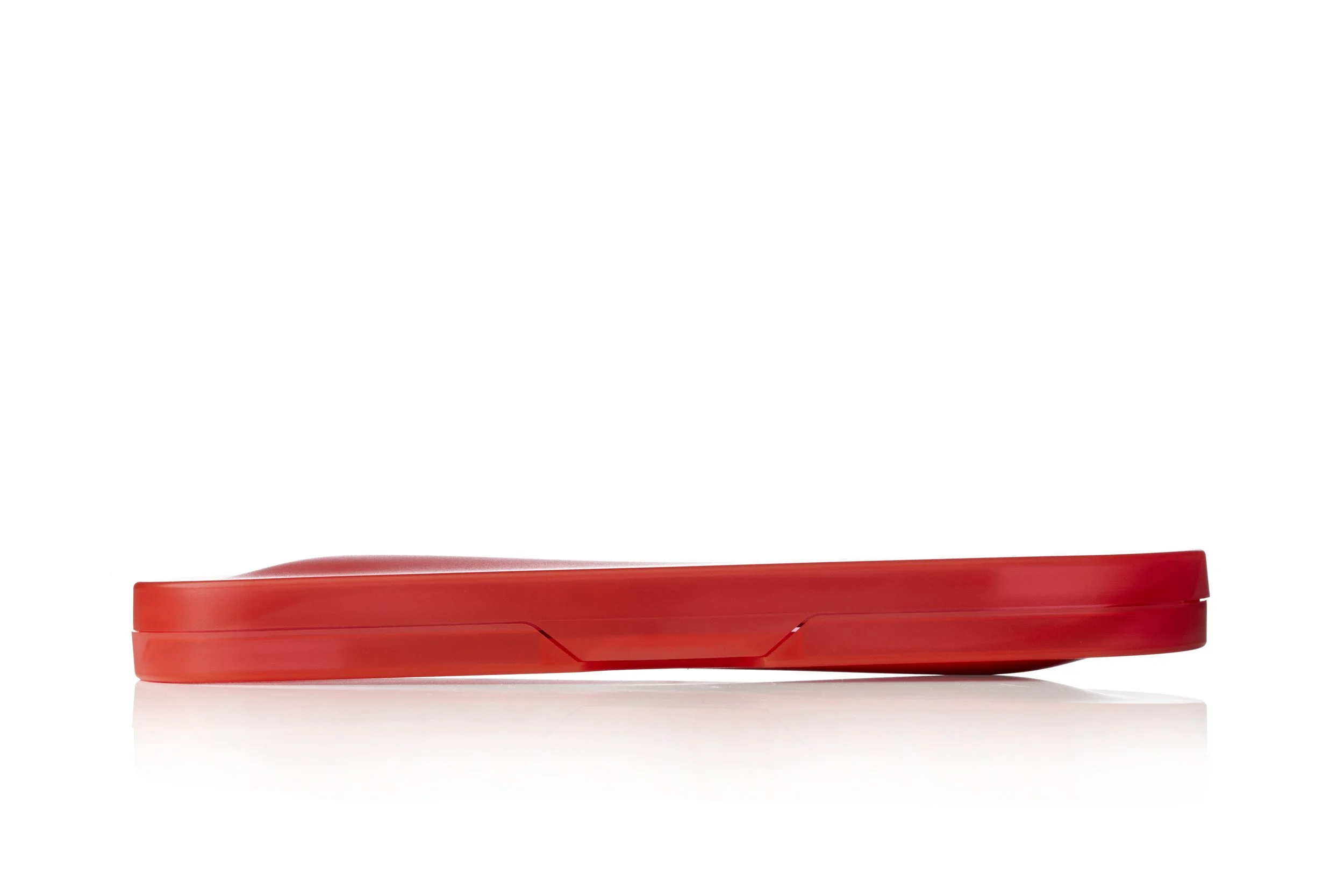 Red plastic shoe tray on a white background.