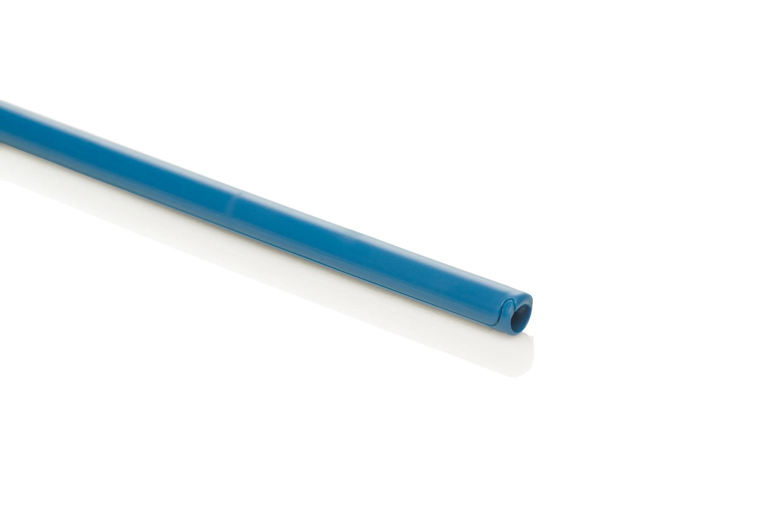 Close-up of a blue plastic straw on a white background