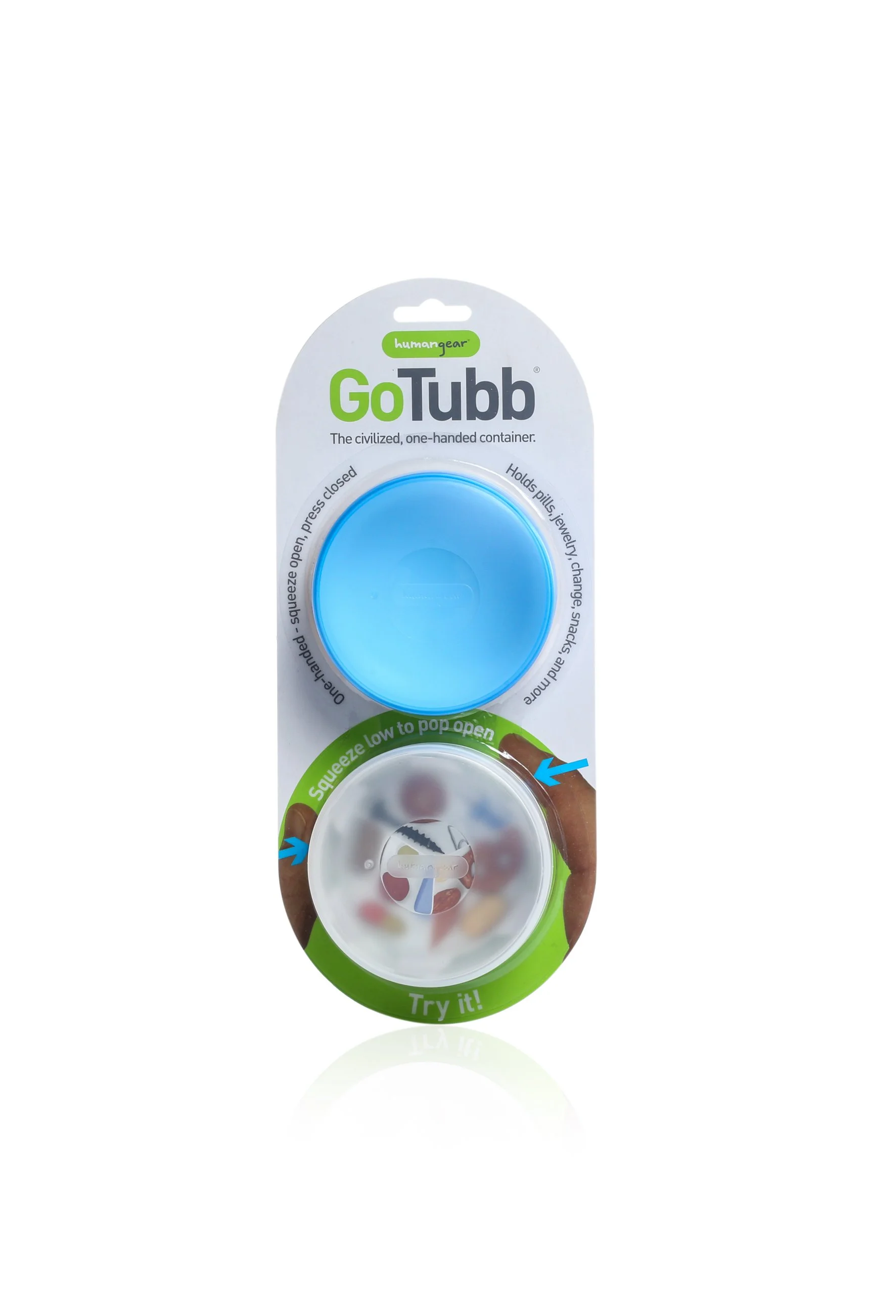Humangear GoTubb container packaging showing a blue and clear one-handed, squeezable container for holding pills and small items.
