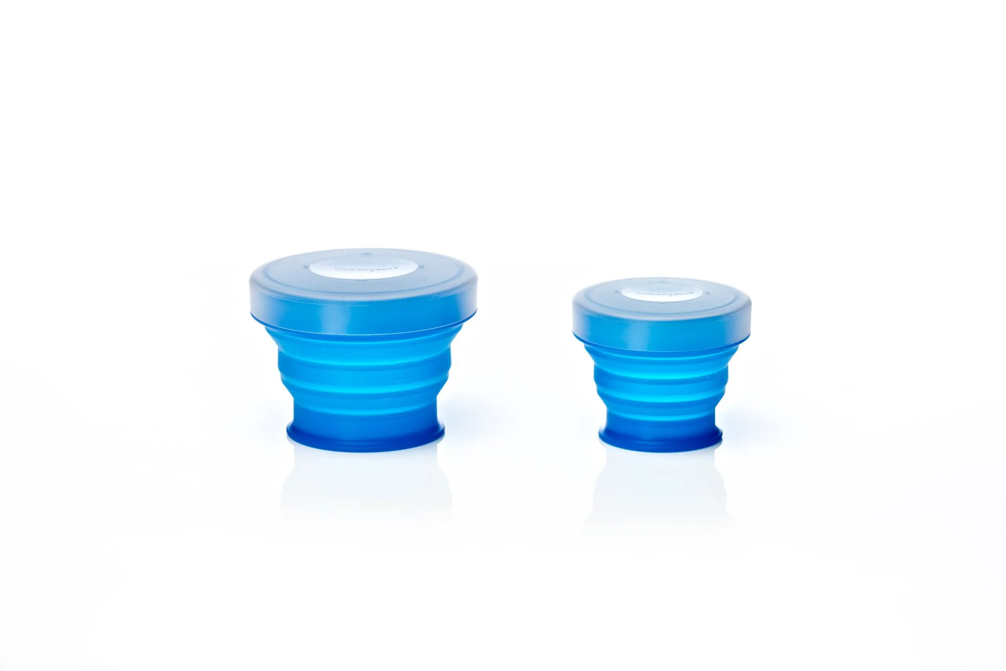 Two blue collapsible silicone containers with lids, on a white background.
