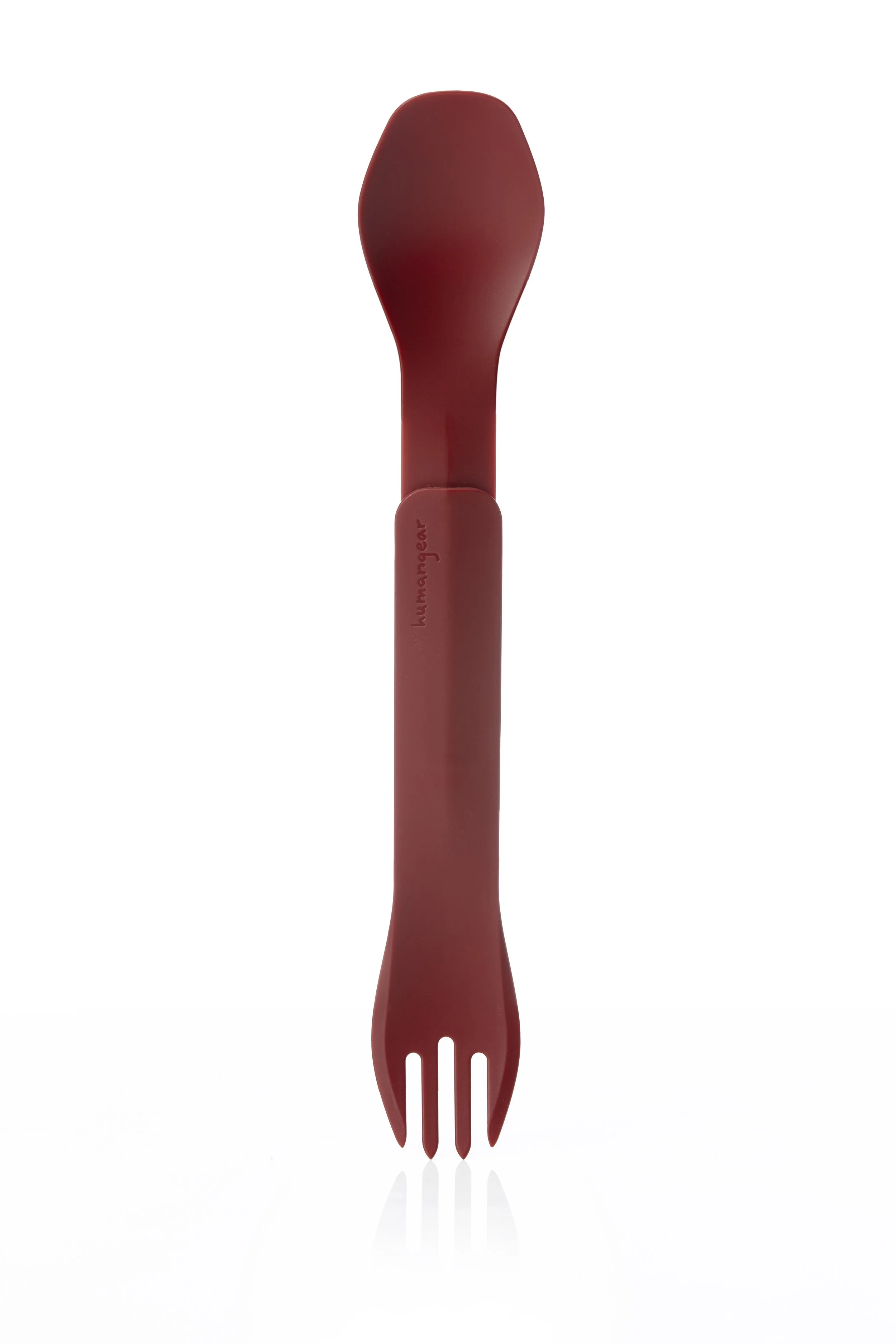 Red plastic spork with a spoon on one end and a fork on the other, labeled "humangear."