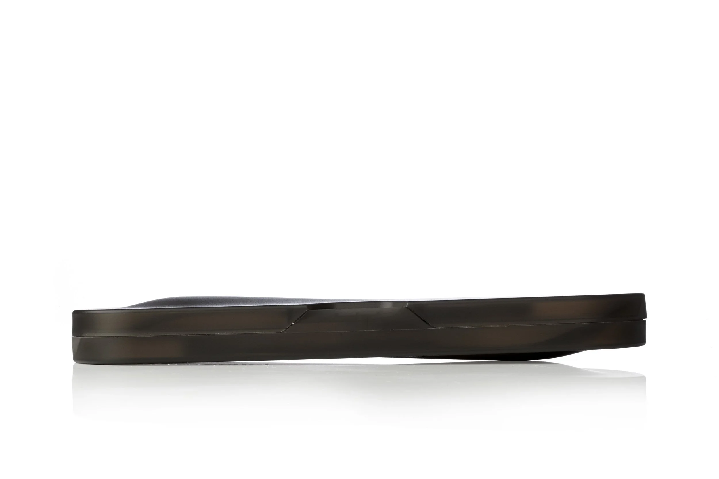 Side view of a black computer mouse against a white background.