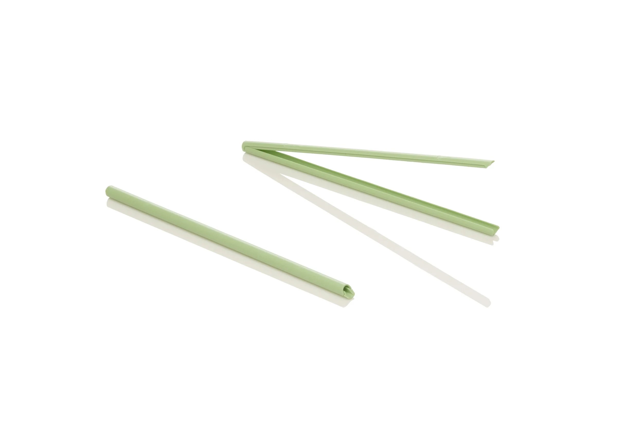 Green reusable straw with a cleaning brush.