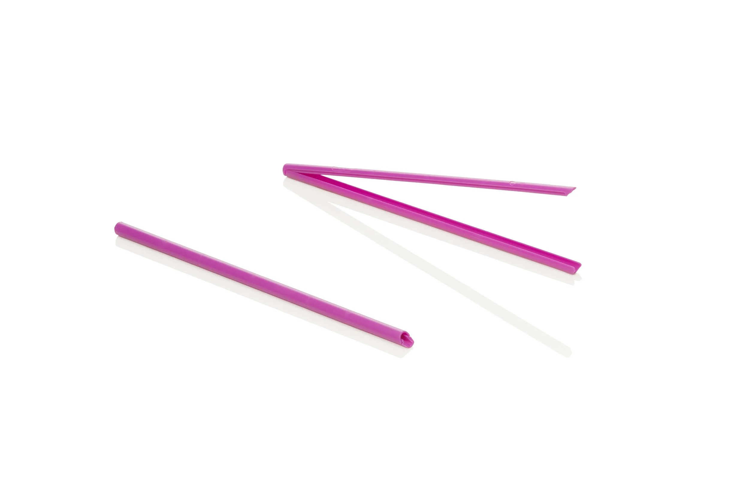 Purple plastic straws on a white background