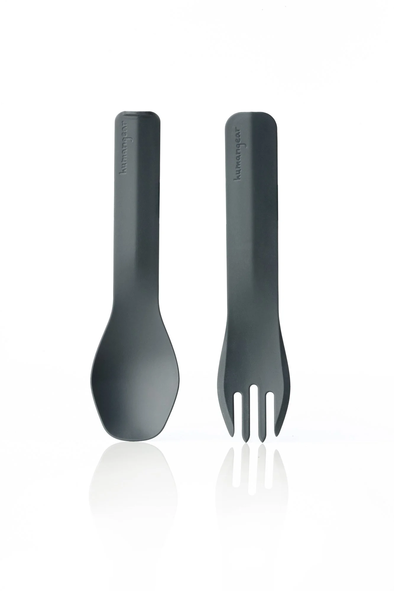 Two black utensils, a spoon and a fork, branded with "humangear," against a white background.