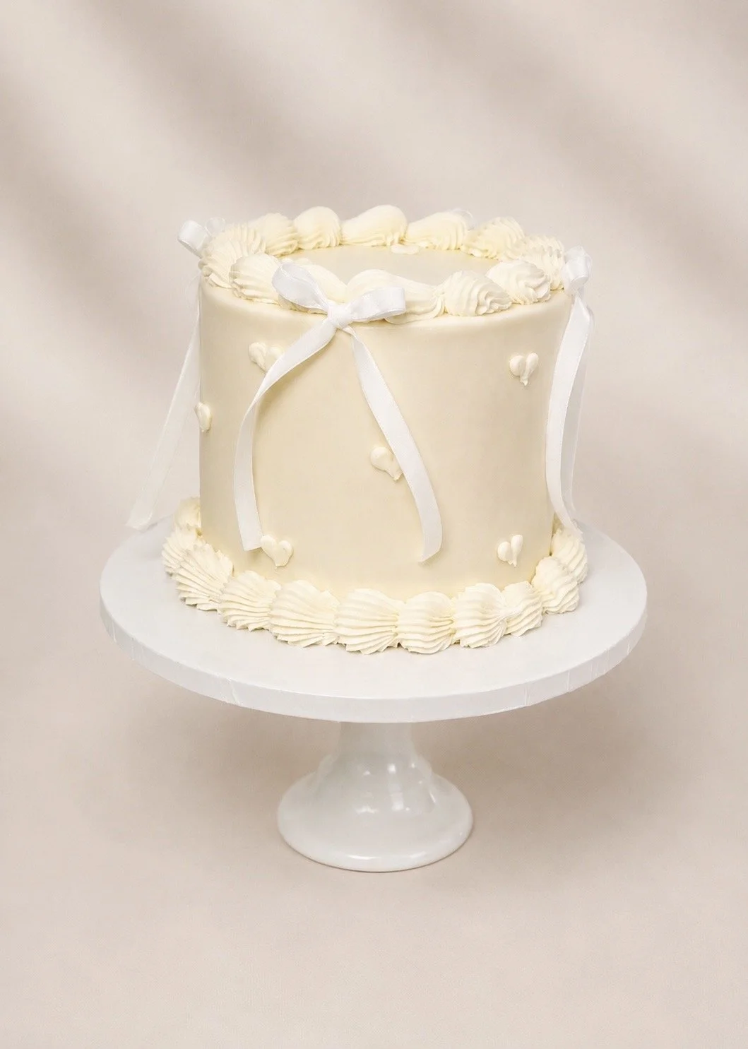 Simple White Vintage Cake with Bows & Hearts by Emporio.jpg