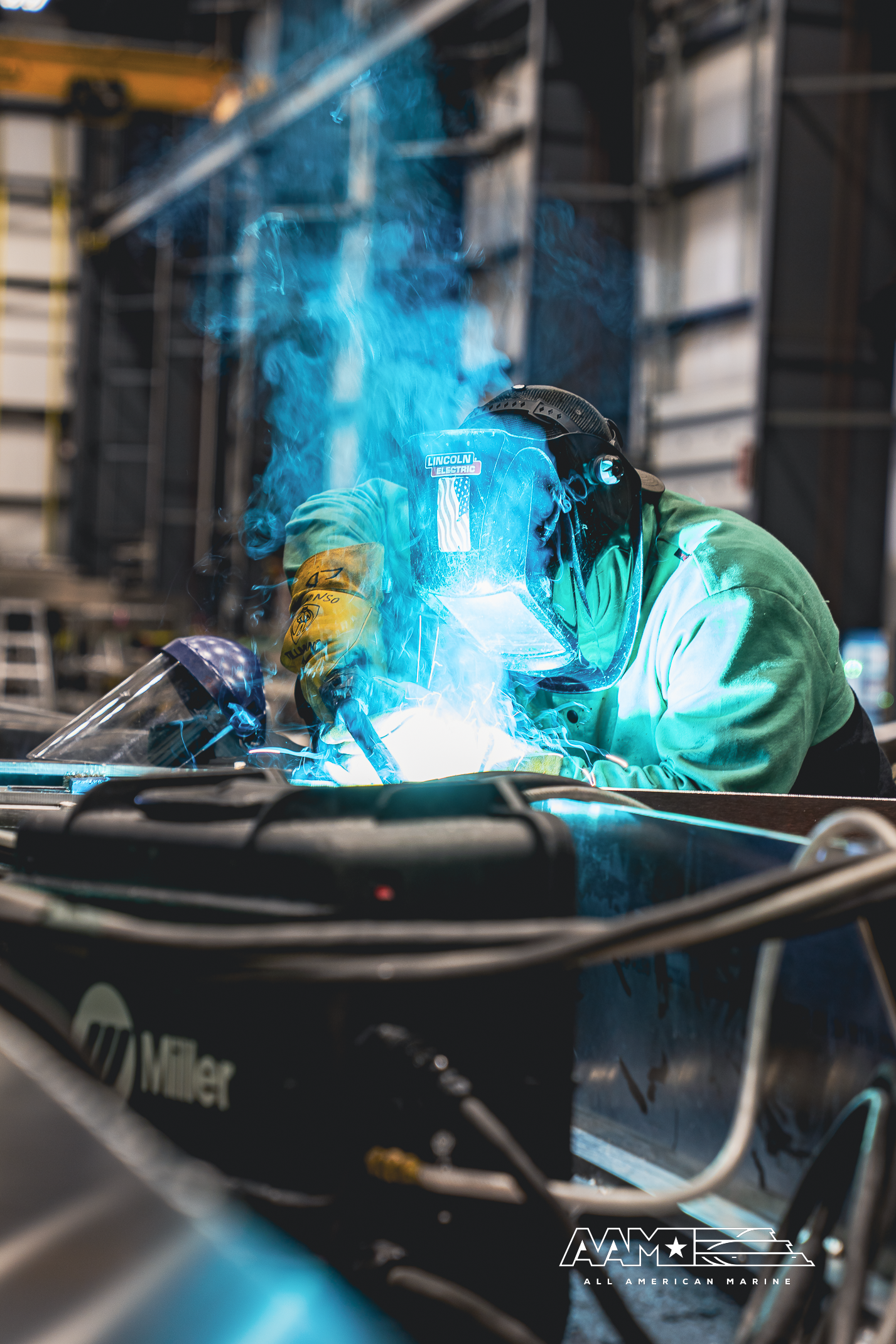 Welder welding aluminum boat parts