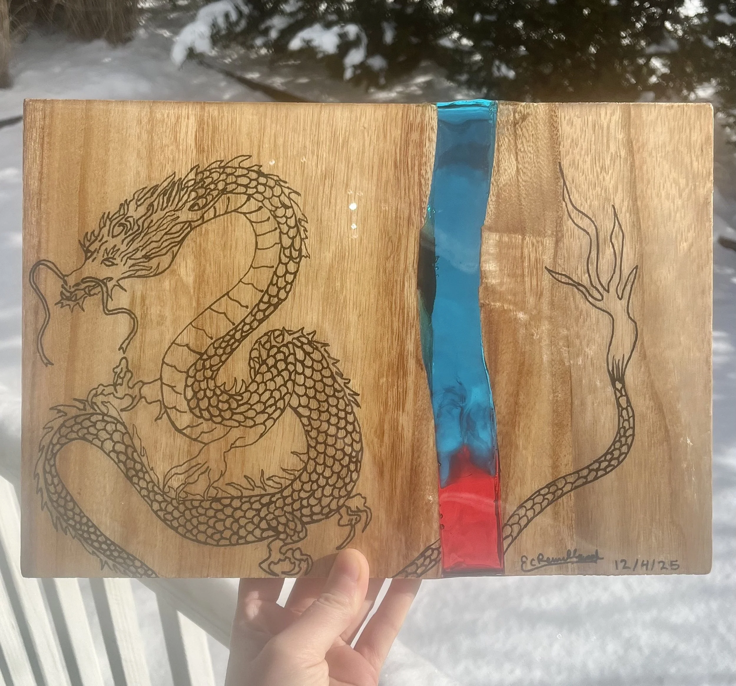 Broken Taekwondo board filled with transparent red and blue resin (dragon drawing done by client)