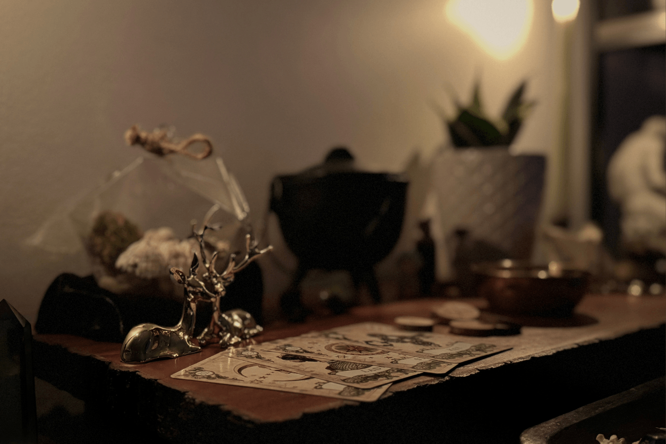 A photo of Ariel's altar space with two golden deer statues