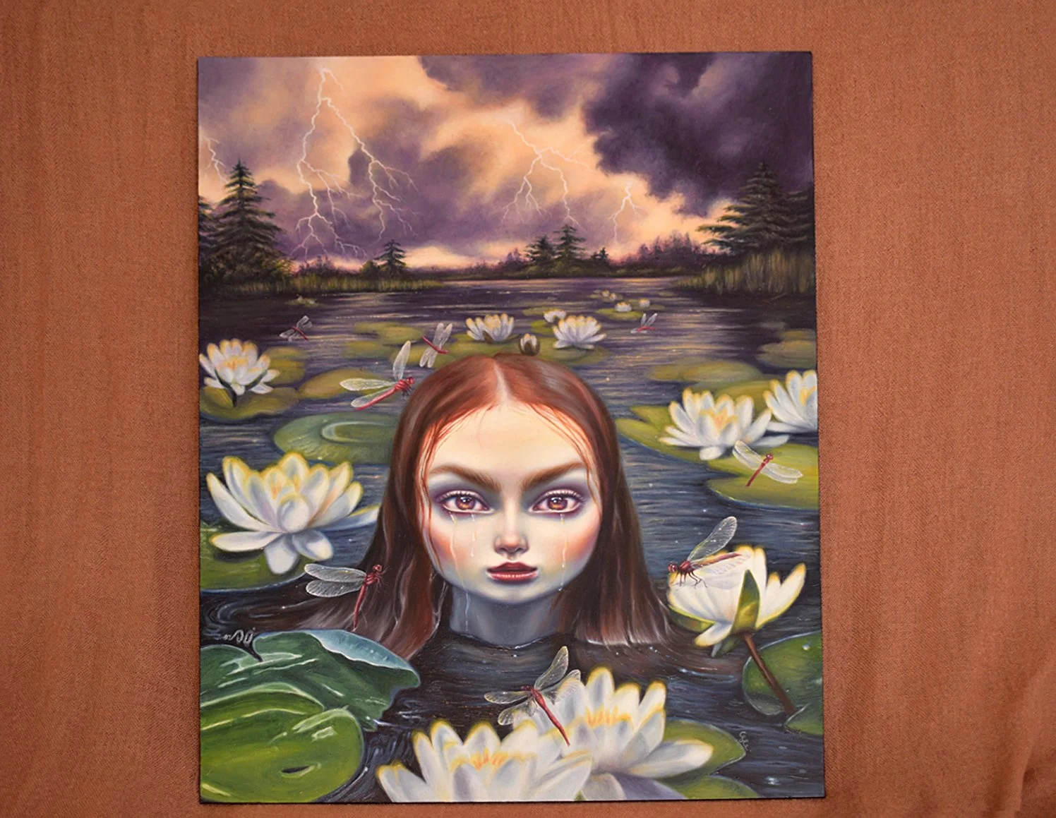 Original Oil Painting of a girl crying in a lake surrounded by dragonflies and lotus flowers with stormy skies behind