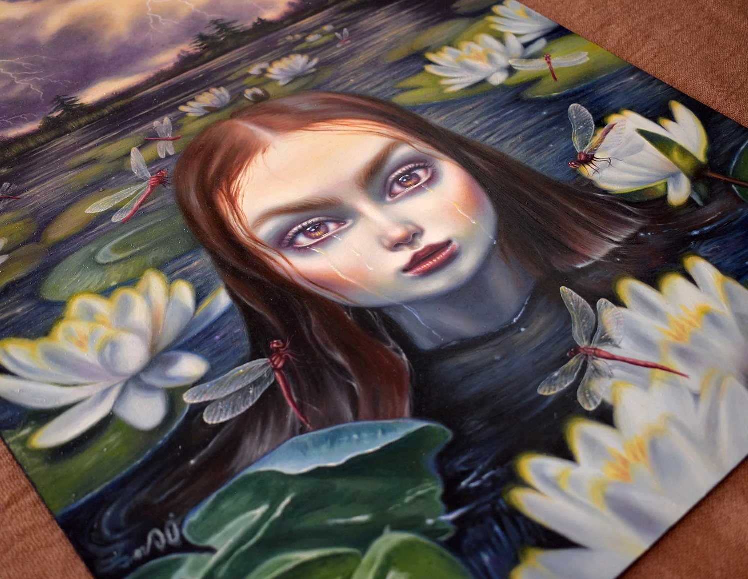 Original Oil Painting of a girl crying in a lake surrounded by dragonflies and lotus flowers with stormy skies behind