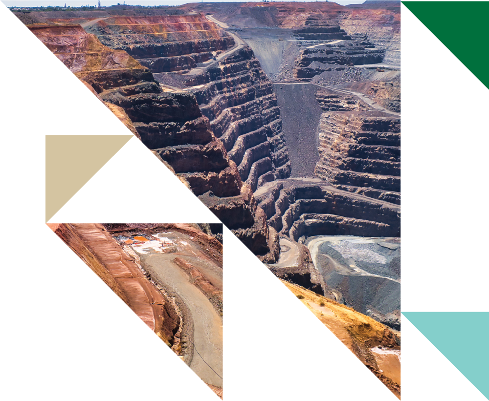 Aerial view of a large open-pit mining operation with terraced levels and excavators.