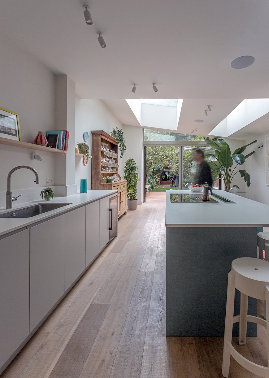 view of the kitchen extension into the garden  - modern floor boards daylight filled room