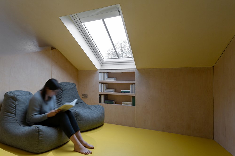 the reading nook integrates a velux conservation roof light 
