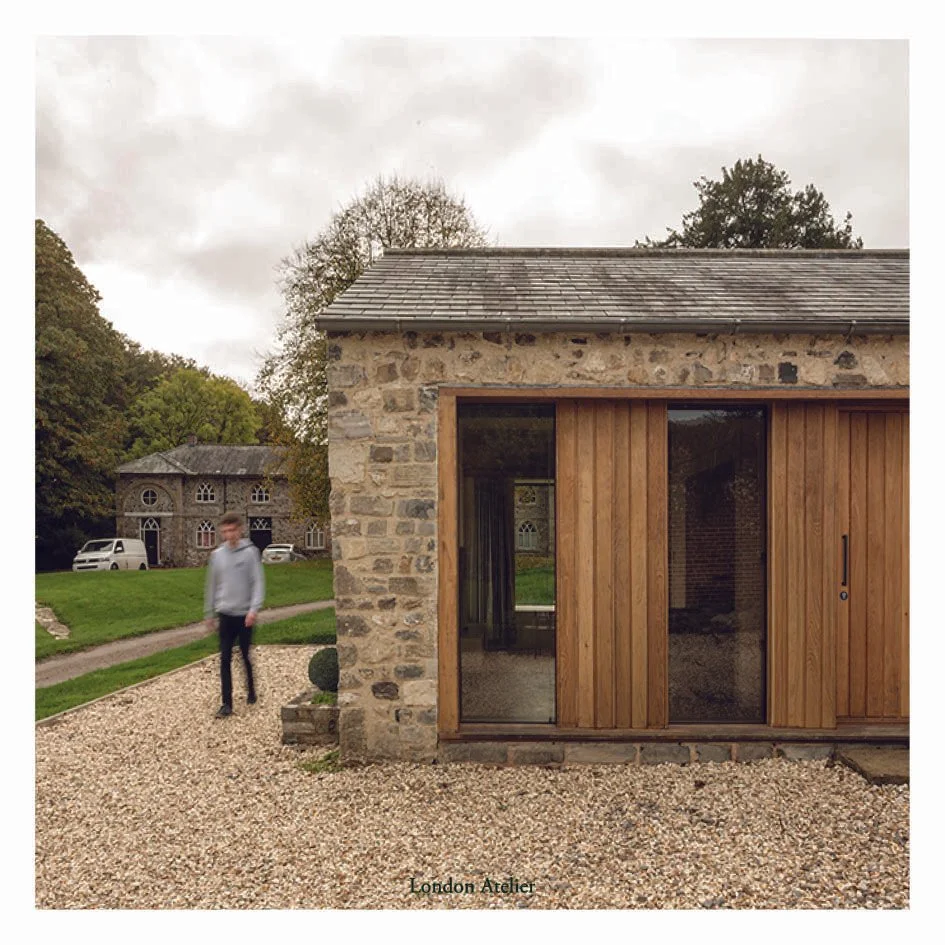The Old Sty project by London Atelier reimagines a previous agricultural structure within a Grade II classified estate in Somerset. The revival of flint stone walls and oak-framed apertures harmonises with modern enhancements, resulting in a serene a