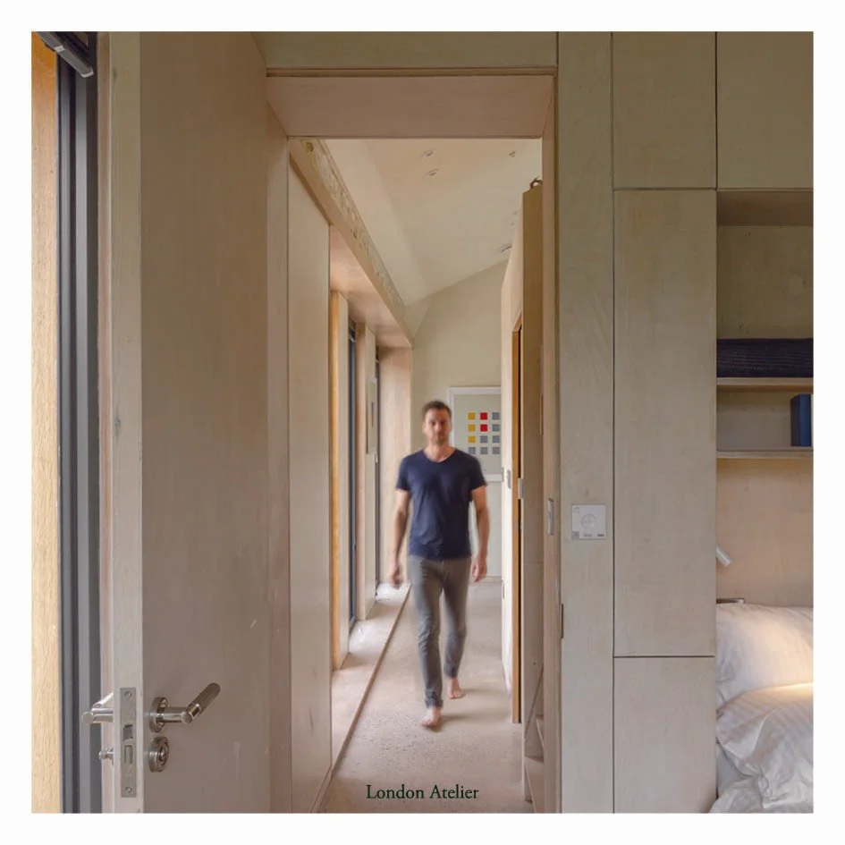 The insertions organise seating, storage and a loft reading nook within the compact plan, while polished concrete flooring links the spaces with a single, quiet surface. Deep window reveals frame the landscape and guide daylight through the interior,