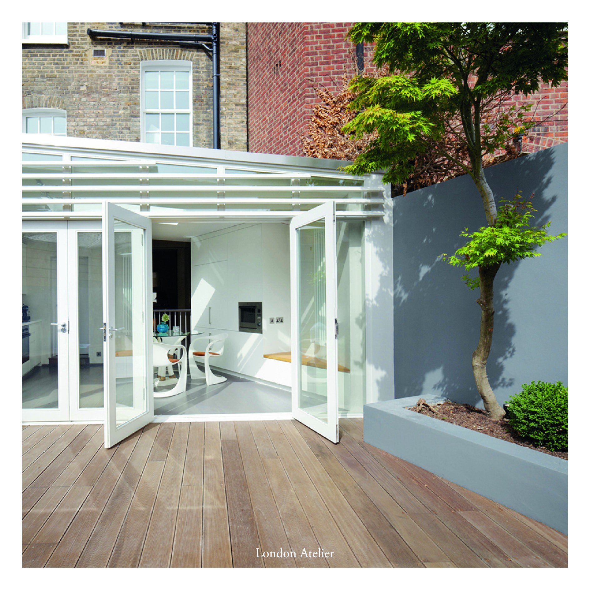 A former bakery in Battersea with an unusual diamond-shaped footprint. A double-height void connects ground floor to basement, bringing the original bread ovens into the centre of the home. A central stair core houses all services and storage, allowi