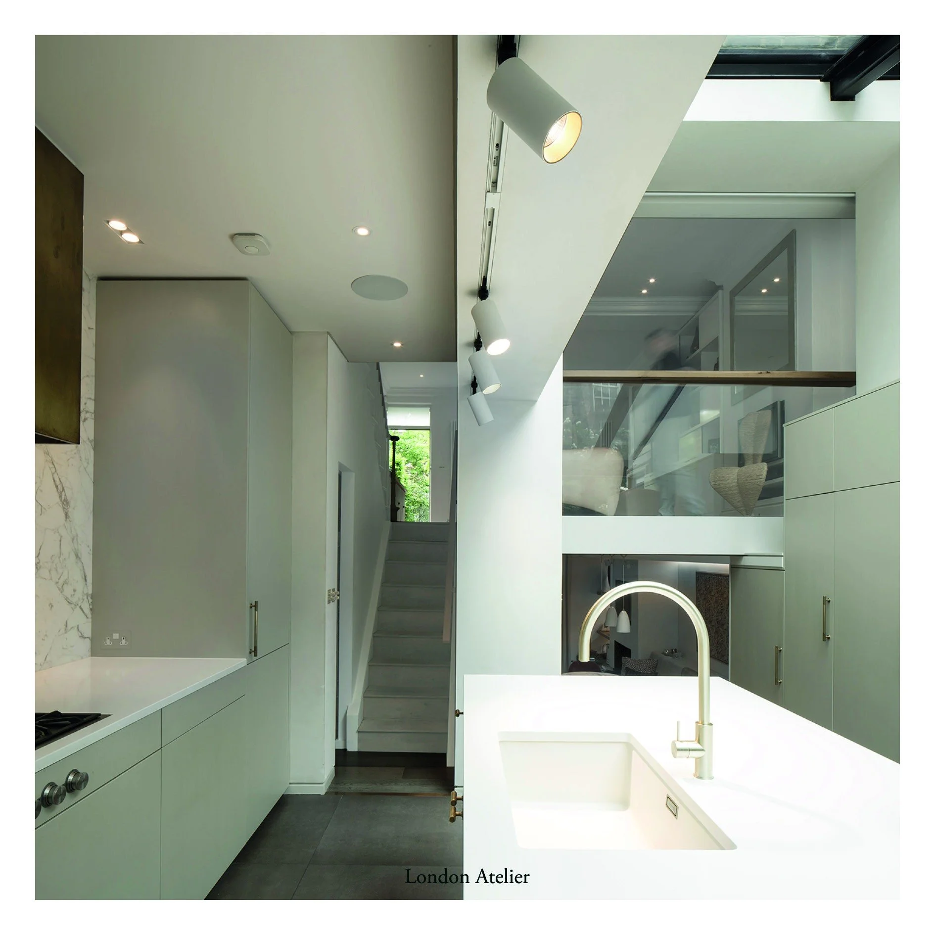 A remodelling and extension of a four-story townhouse, Casa della Torta places the kitchen central to the home after studying the family's daily routine. The floor plates were opened and spaces connected vertically at different levels, bypassing the 