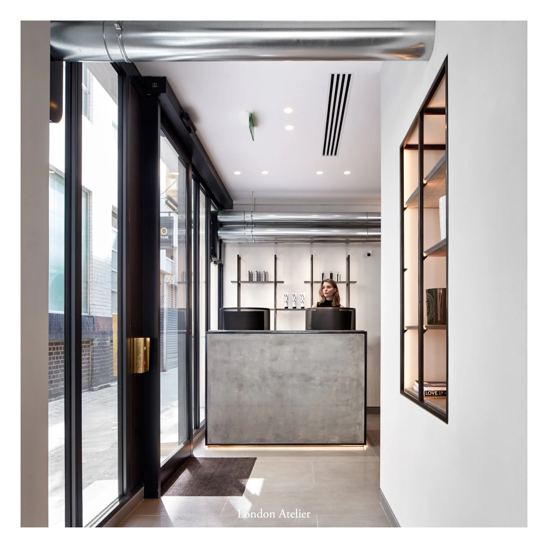 An extensive remodelling of a flagship hairdresser's salon spanning two stories within the Harley Street Conservation Area. A thoughtful material palette of bespoke metal fixtures, cast concrete, and brass creates a sophisticated space with a light i
