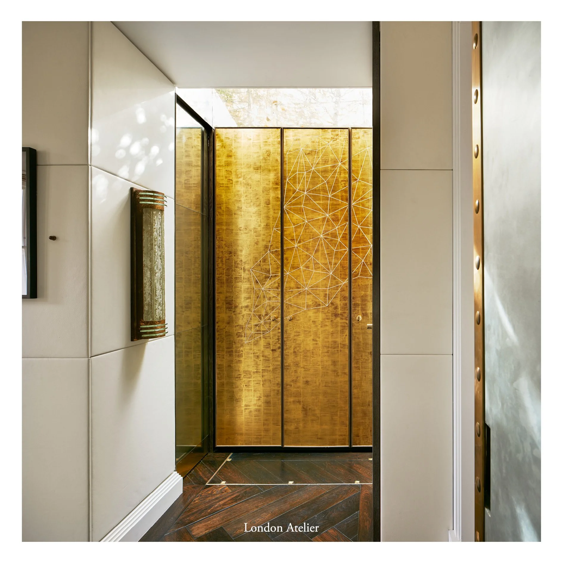 A refurbishment and remodelling of two lower ground floor flats near Holland Park, merged into one property centred around an existing lightwell. A glass extension draws light into the heart of this Victorian home while creating a new link between ro