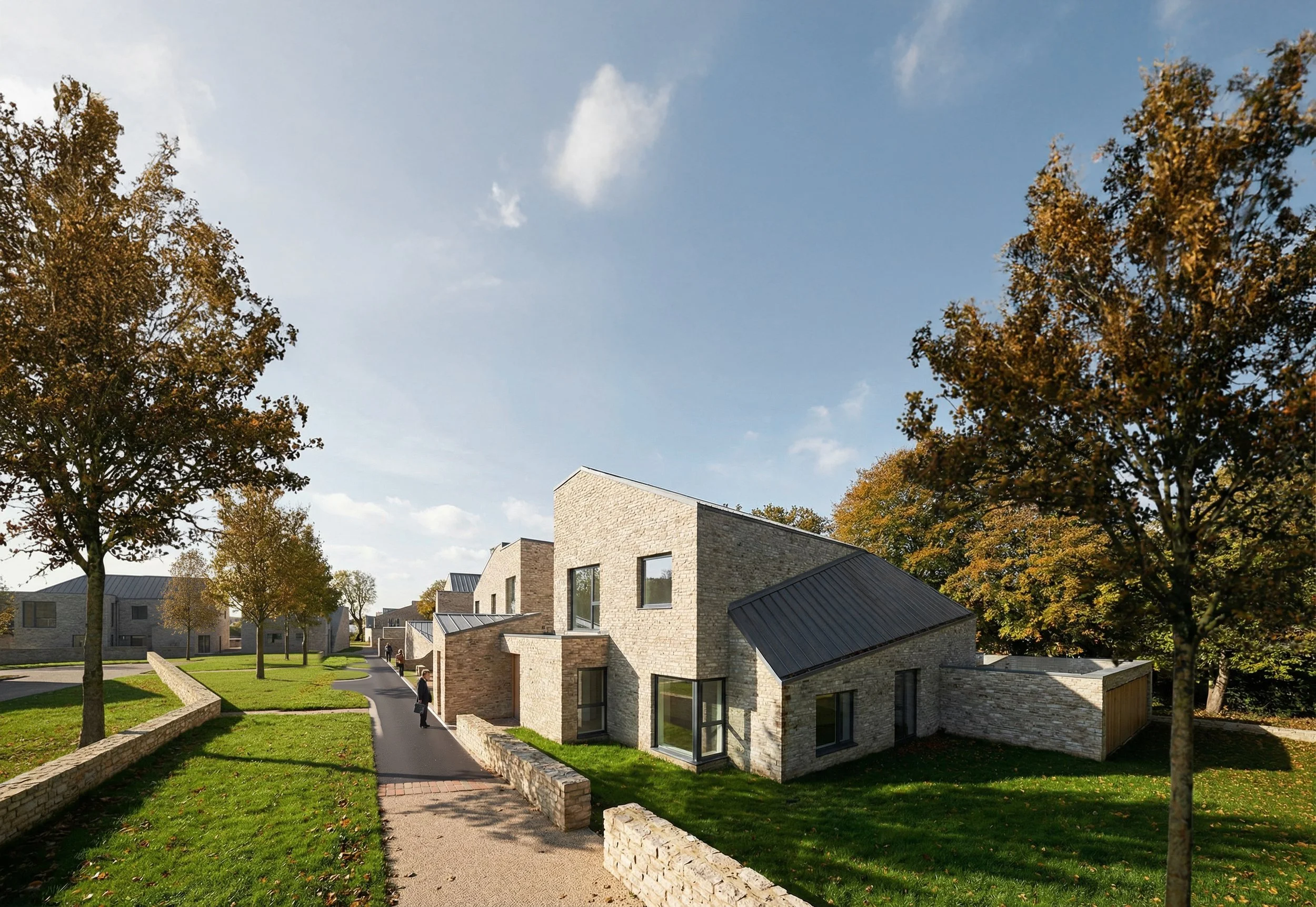 Perspective view along an internal residential lane showing contemporary brick houses with pitched metal roofs and timber elements, set within landscaped green spaces and framed by trees.