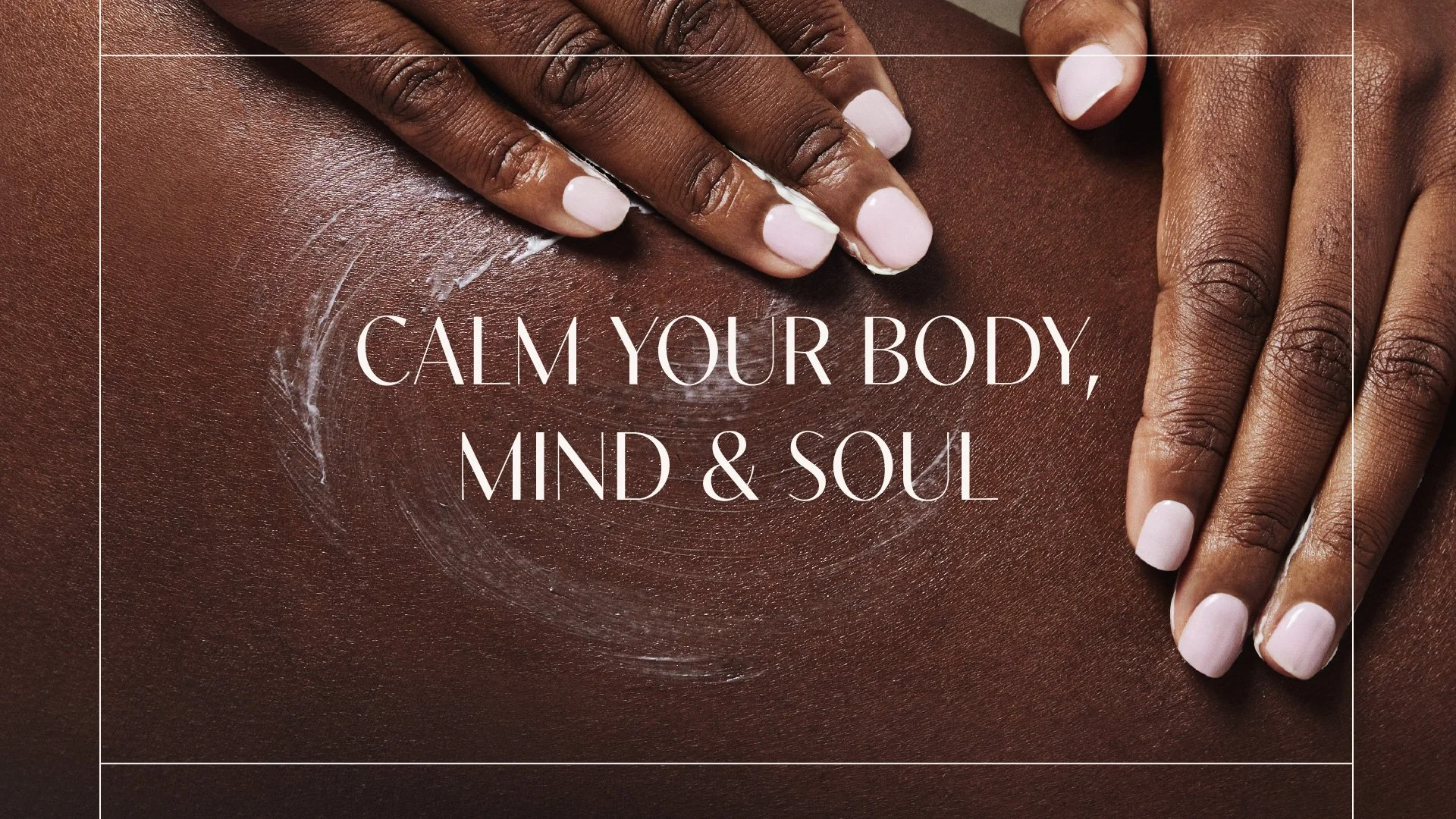 Close-up of a person's hand with manicured nails applying lotion or cream to their skin, with text overlay that reads 'Calm your body, mind & soul'.