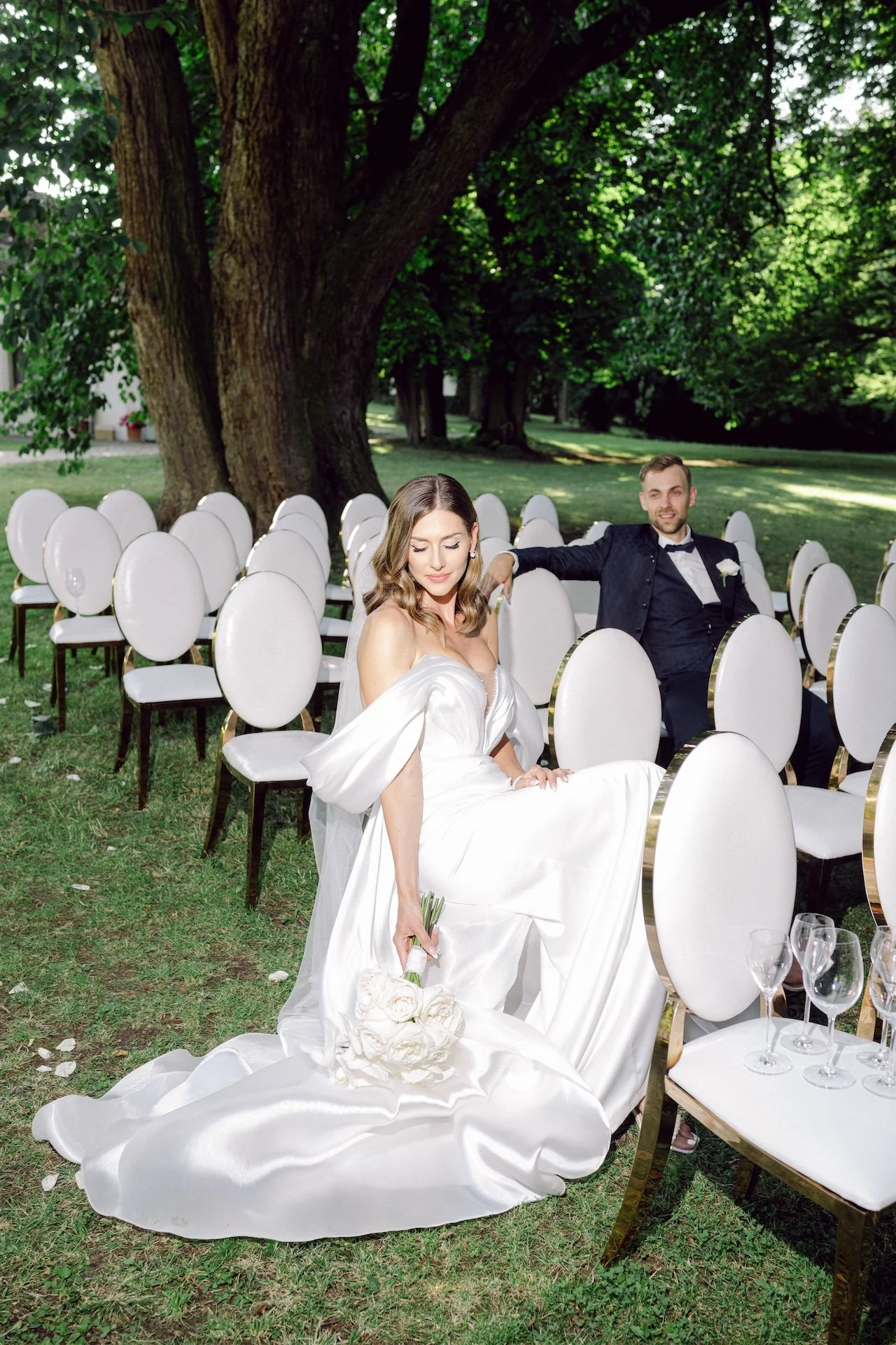 Wedding portrait of the sitting couple - Denisa and Jan Ruta at chateau Nimerice