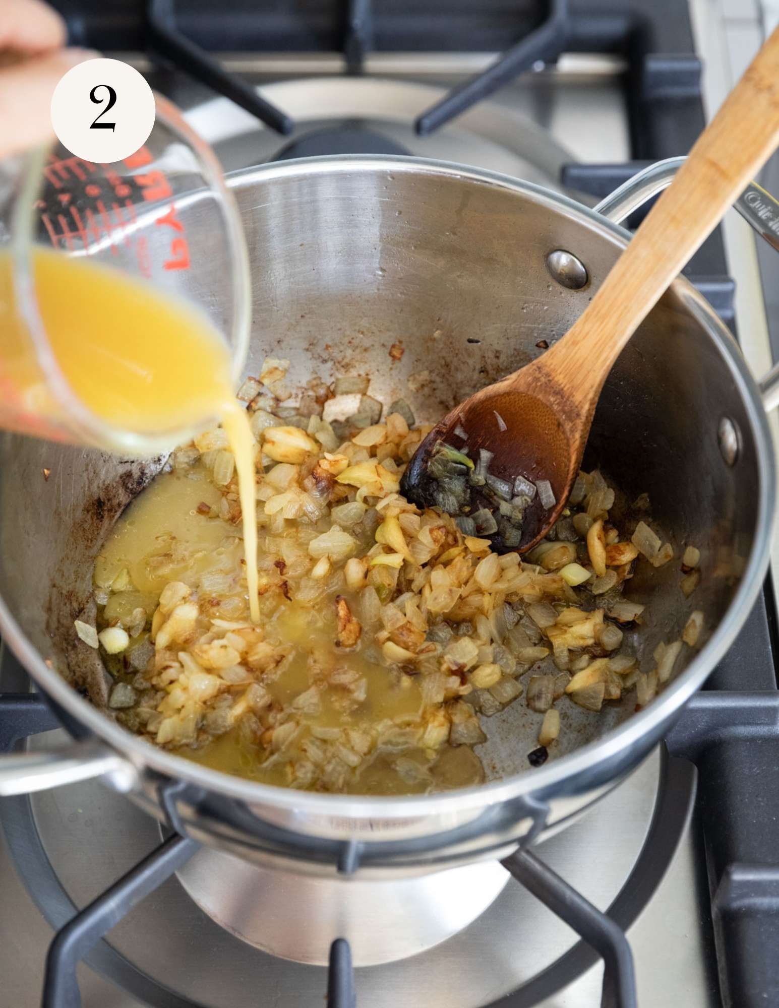 Deglazing the pan with vegetable broth.