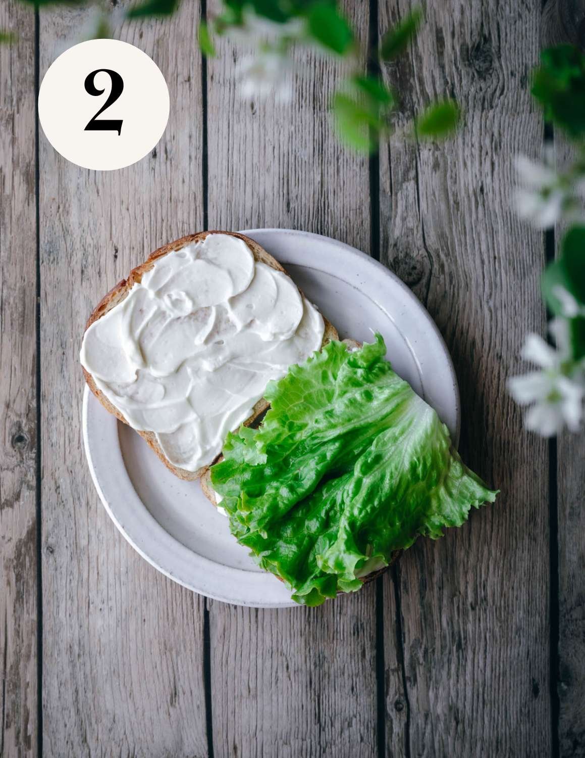 Lettuce on bread with vegan mayonnaise.