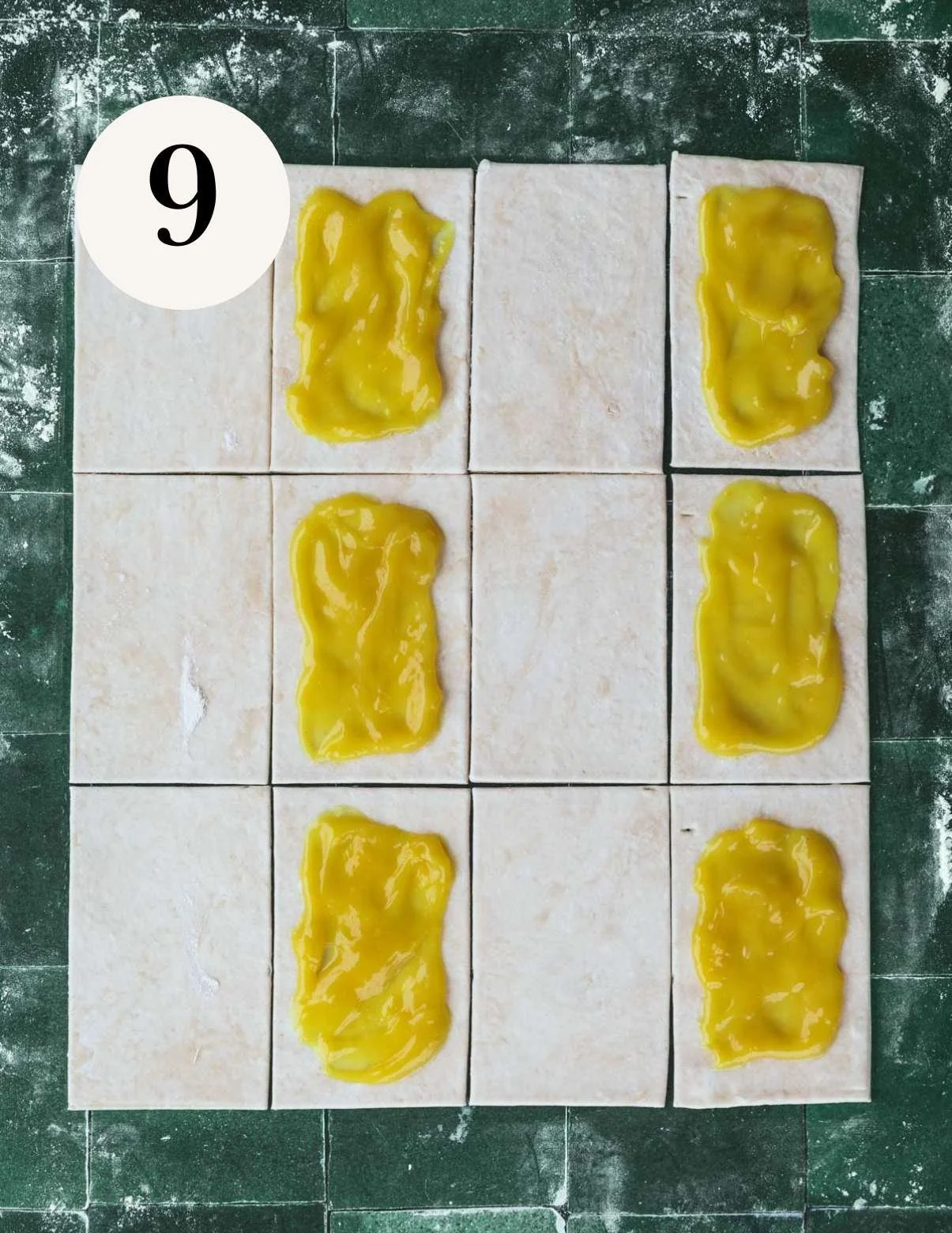 Vegan lemon filling on pastry crust squares.