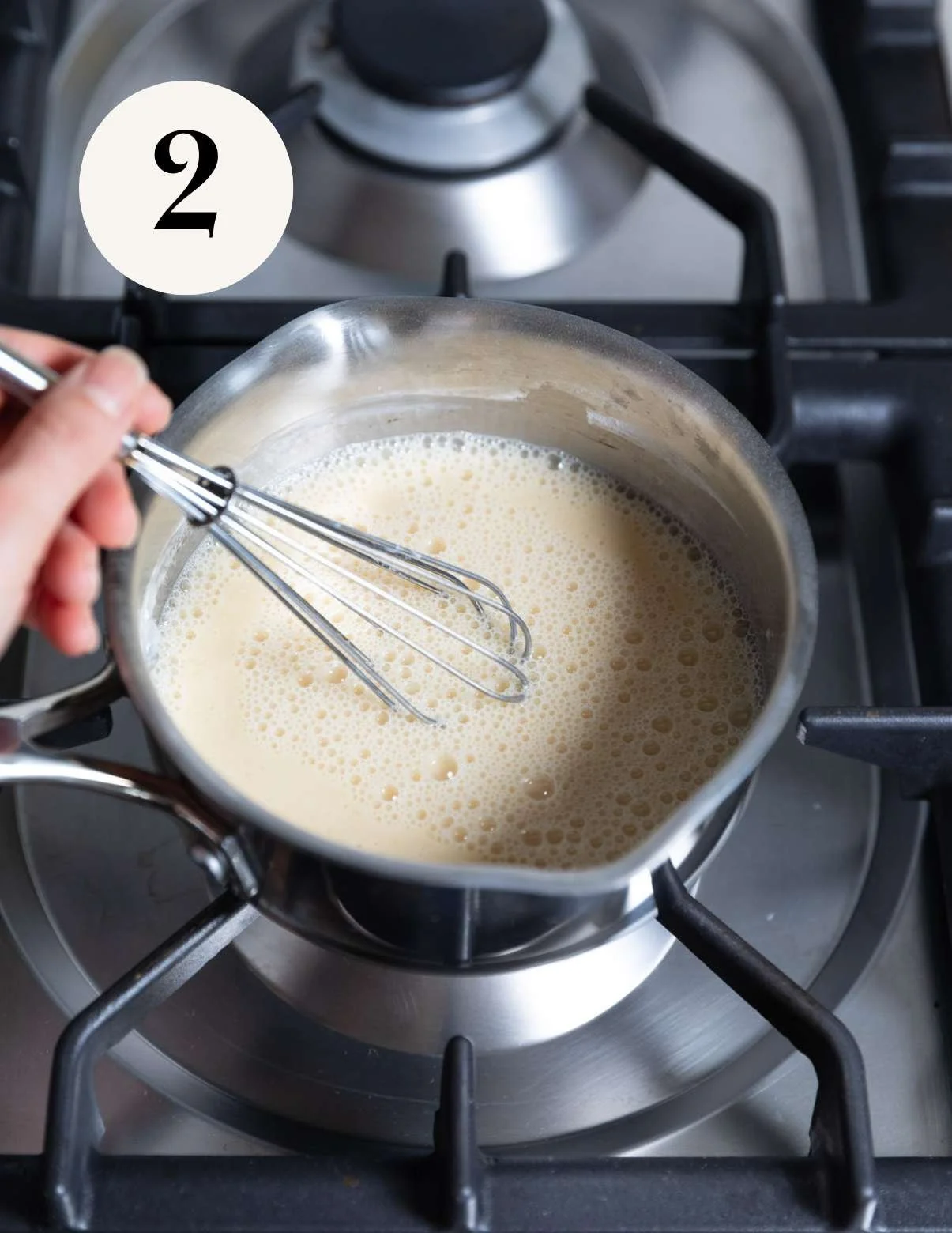 Mixing vegan lemon curd in a saucepan.