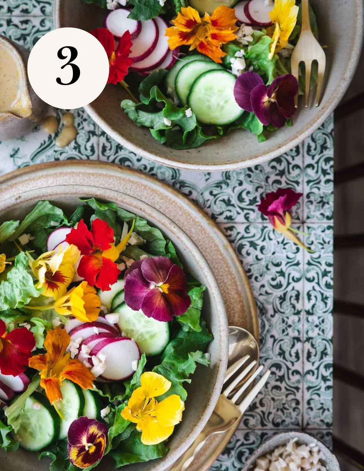 edible flowers on top of a garden salad