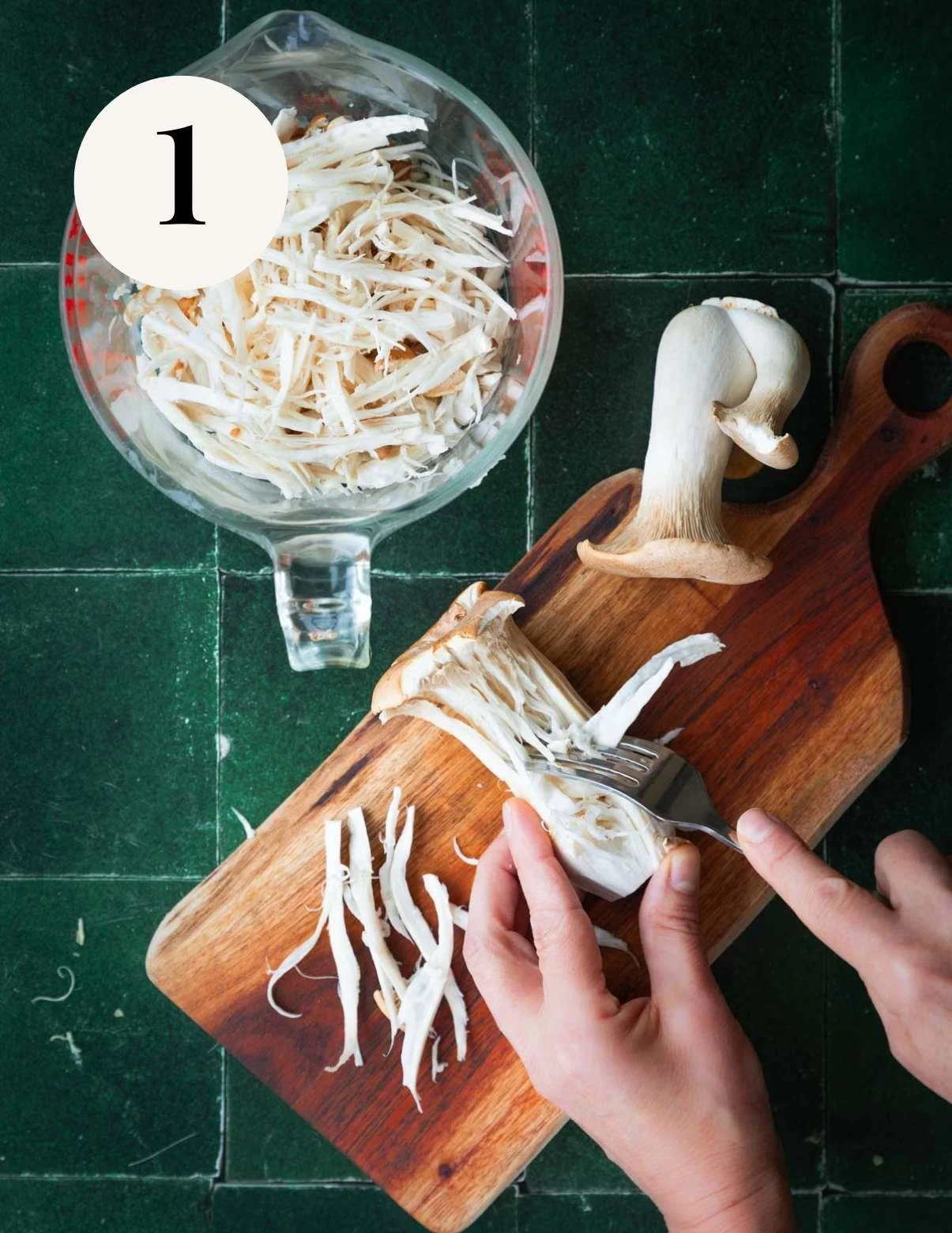 Shredding king oyster mushrooms.