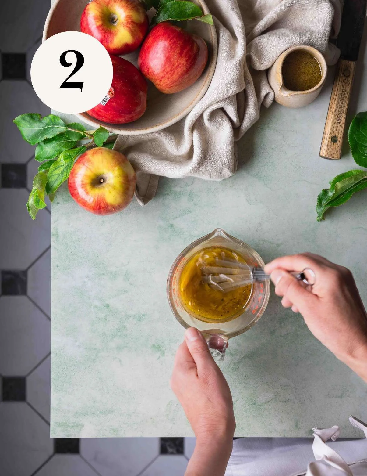 whisking apple cider vinaigrette