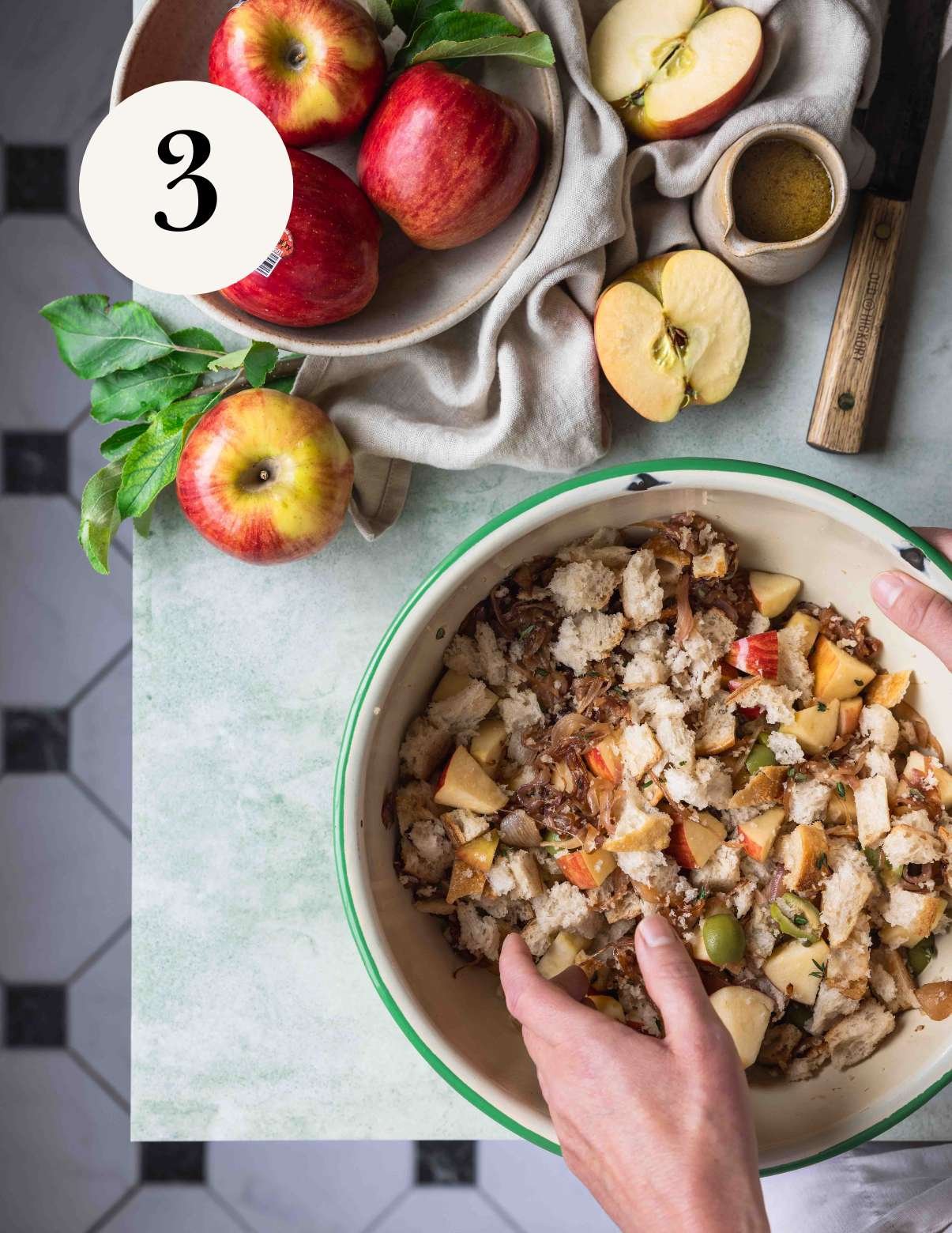 mixing apple panzanella in a large bowl